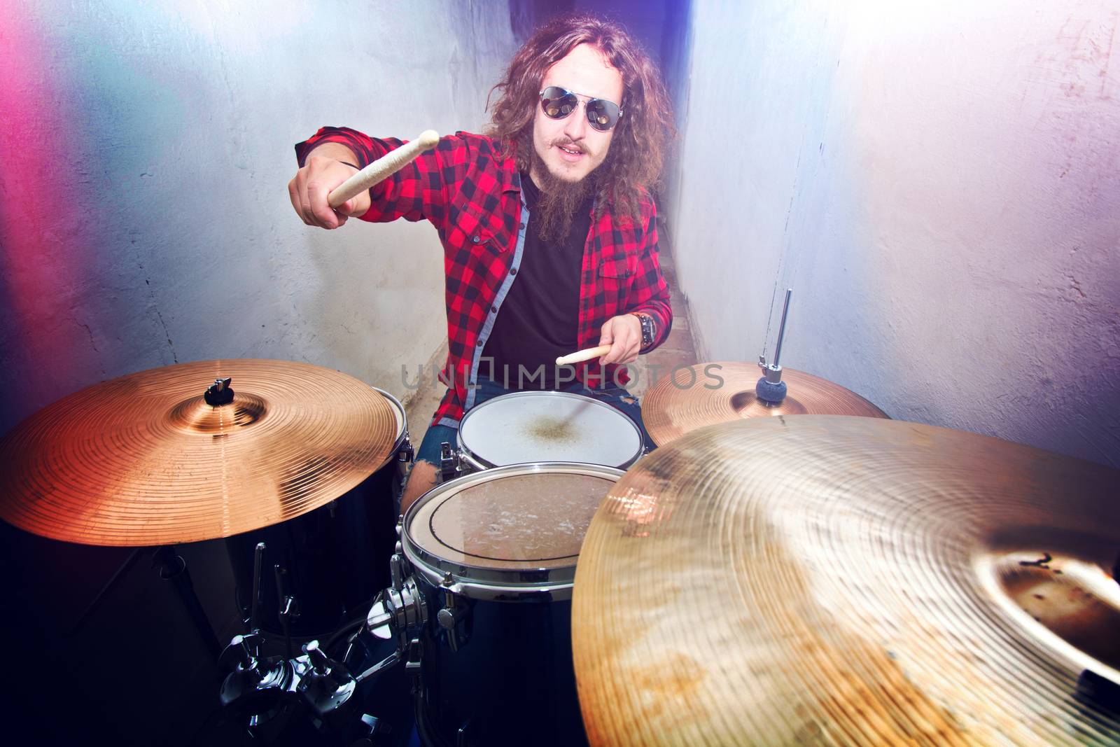 Drums conceptual image. Rock drummer playing on drums. Retro vintage instagram picture.