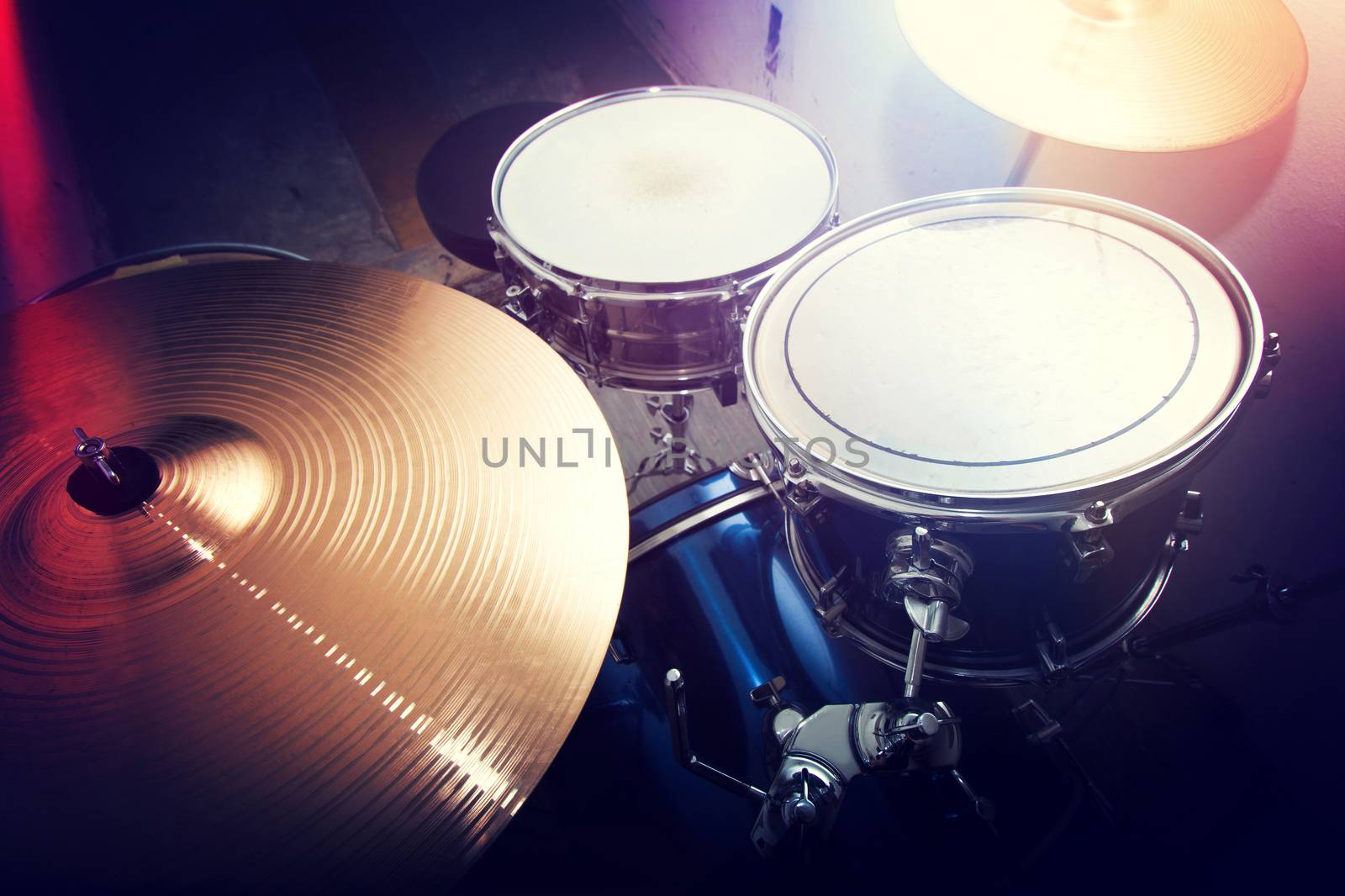 Drums conceptual image. Picture of drums and drumsticks lying on snare drum. Retro vintage instagram picture.