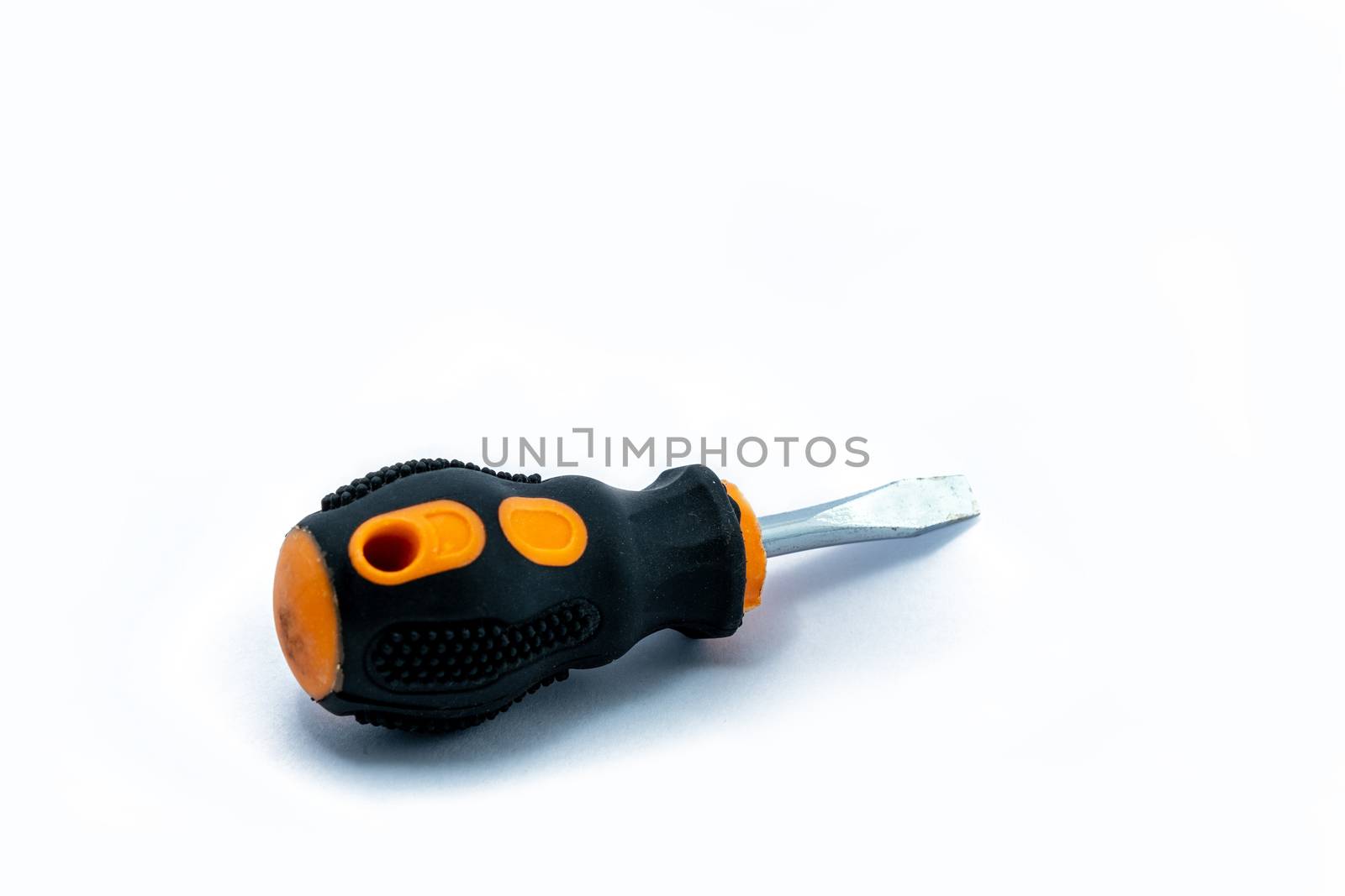 Professional slotted Screwdriver with a Yellow-Black plastic handle. construction tool isolated on white background. Cruciform for repair and construction. by peerapixs