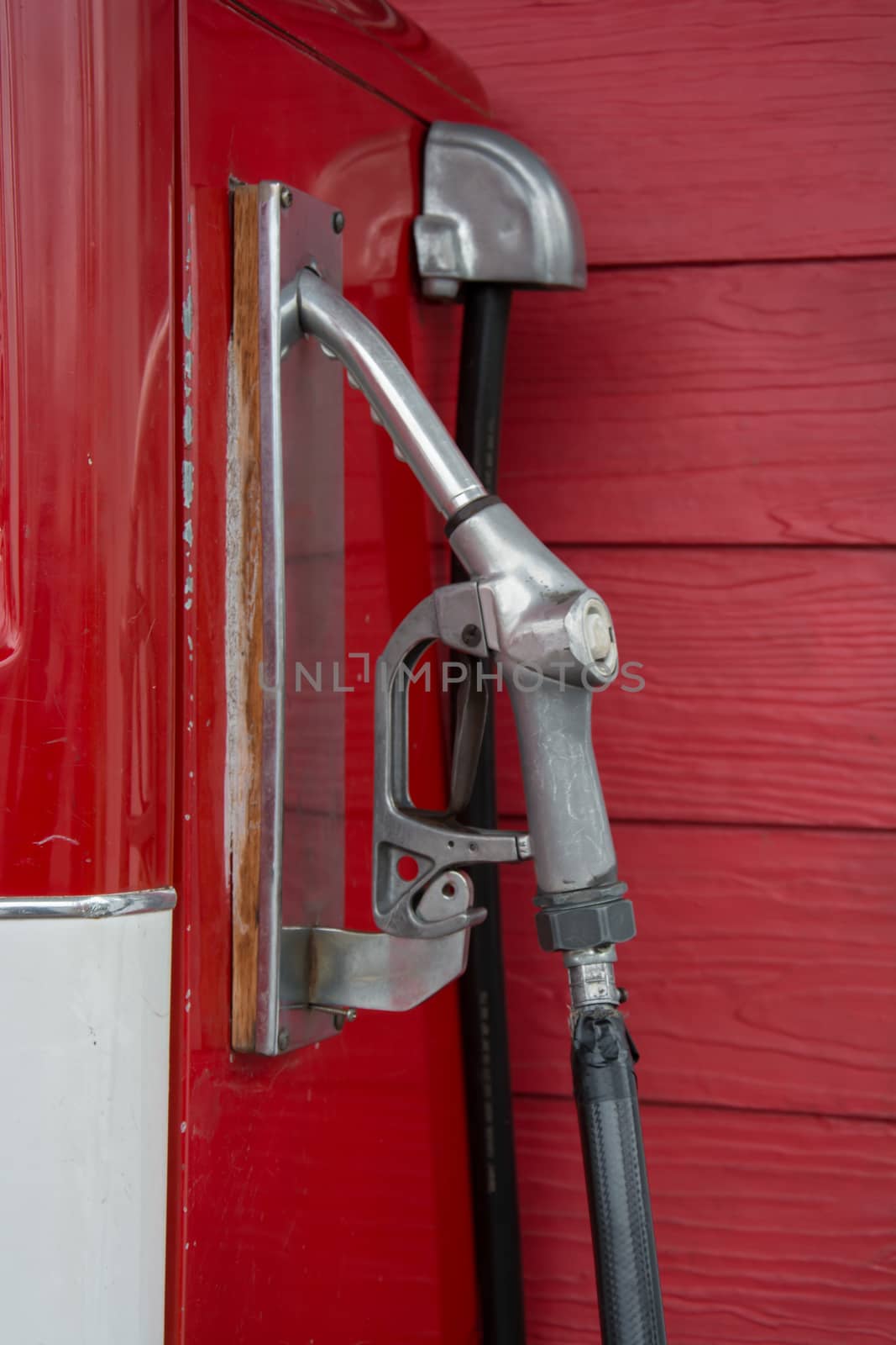 the Gas pump nozzles in the retro service station, vintage color tone