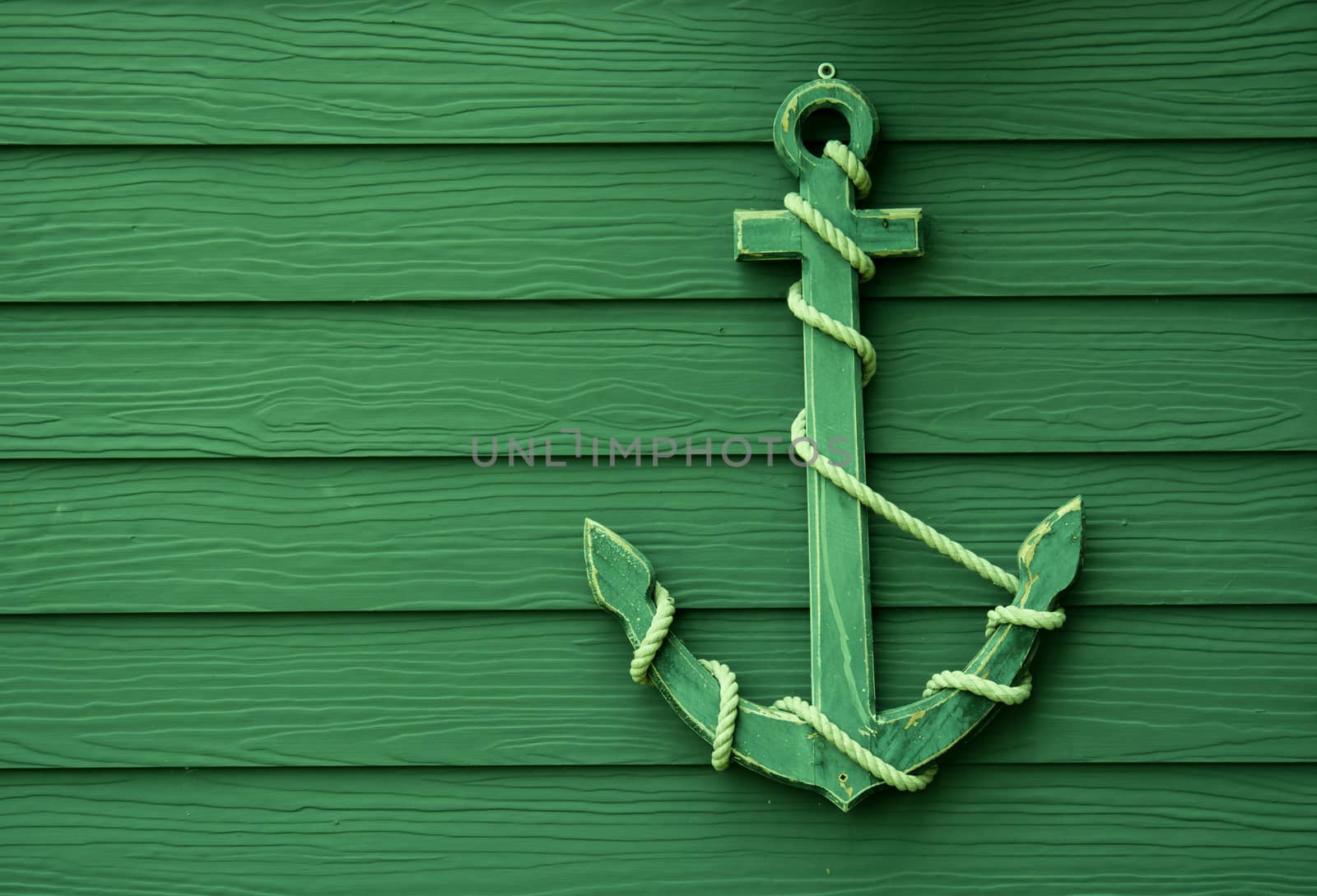 wooden anchor on wall vintage background