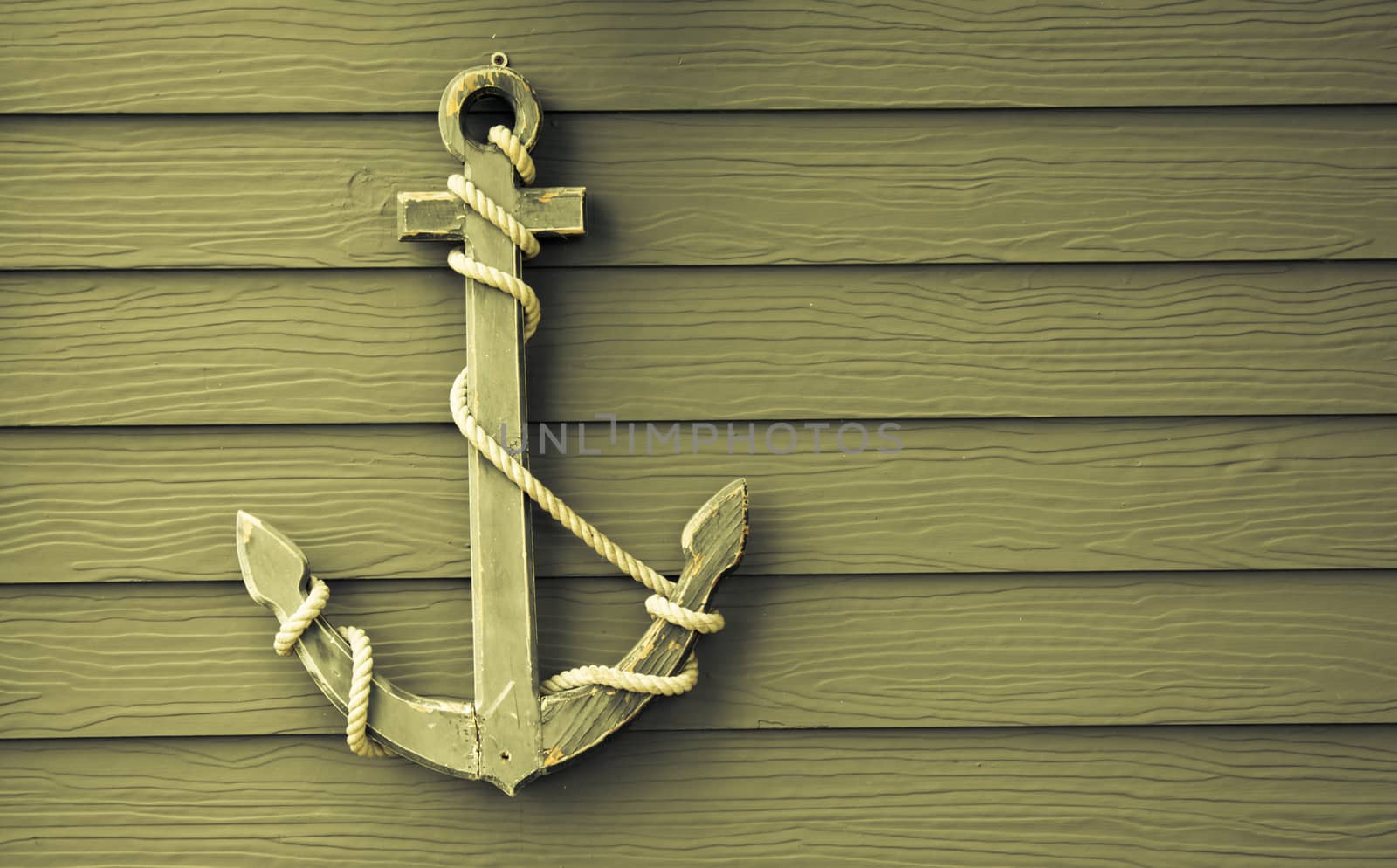 wooden anchor on wall vintage background