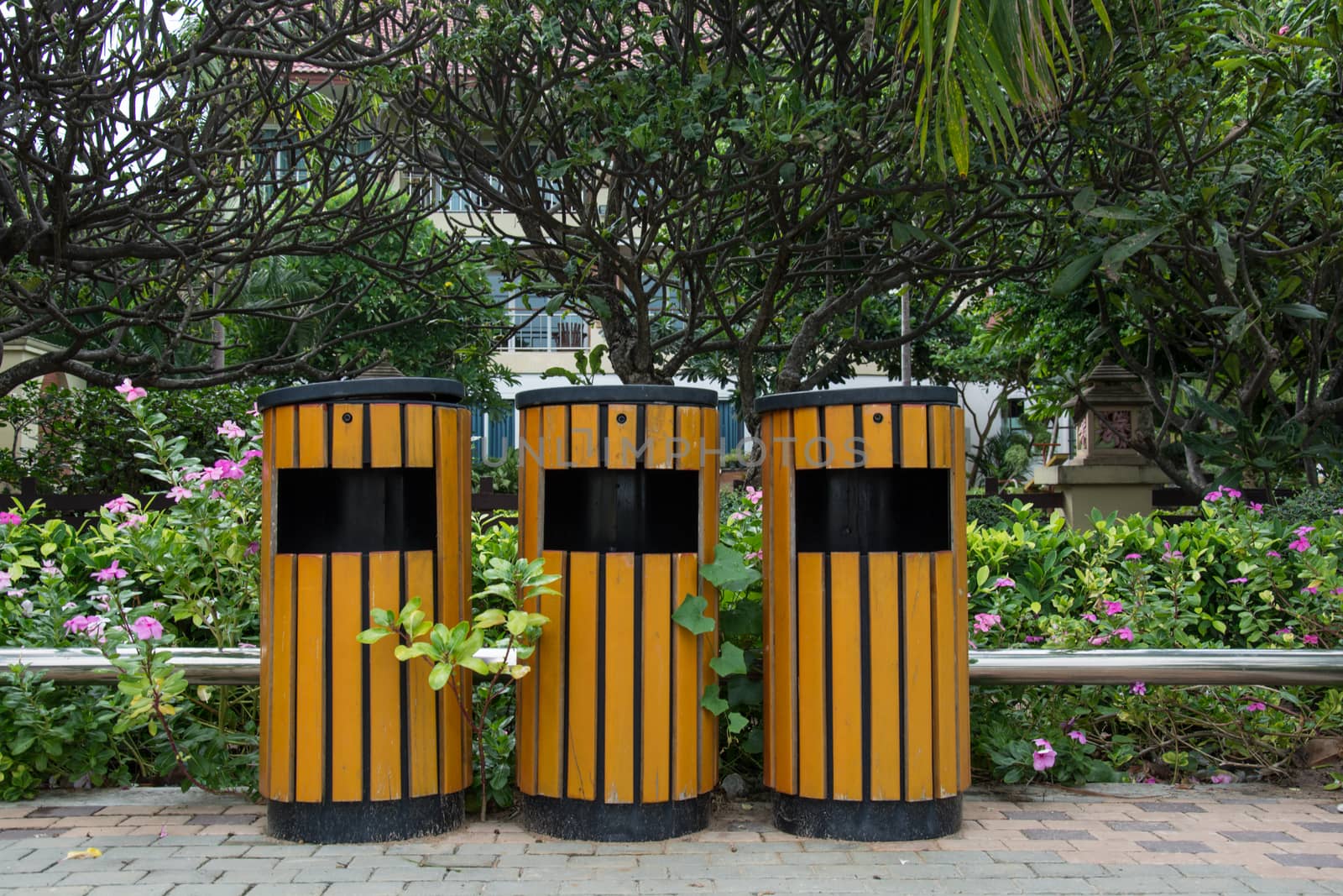 Wood trash bin in the garden
