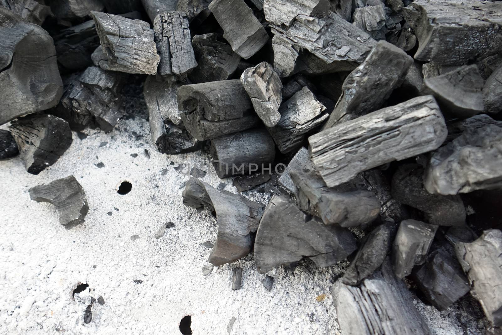 Burnt charcoal in BBQ Stove. Nature Background Concept. by chadchai_k