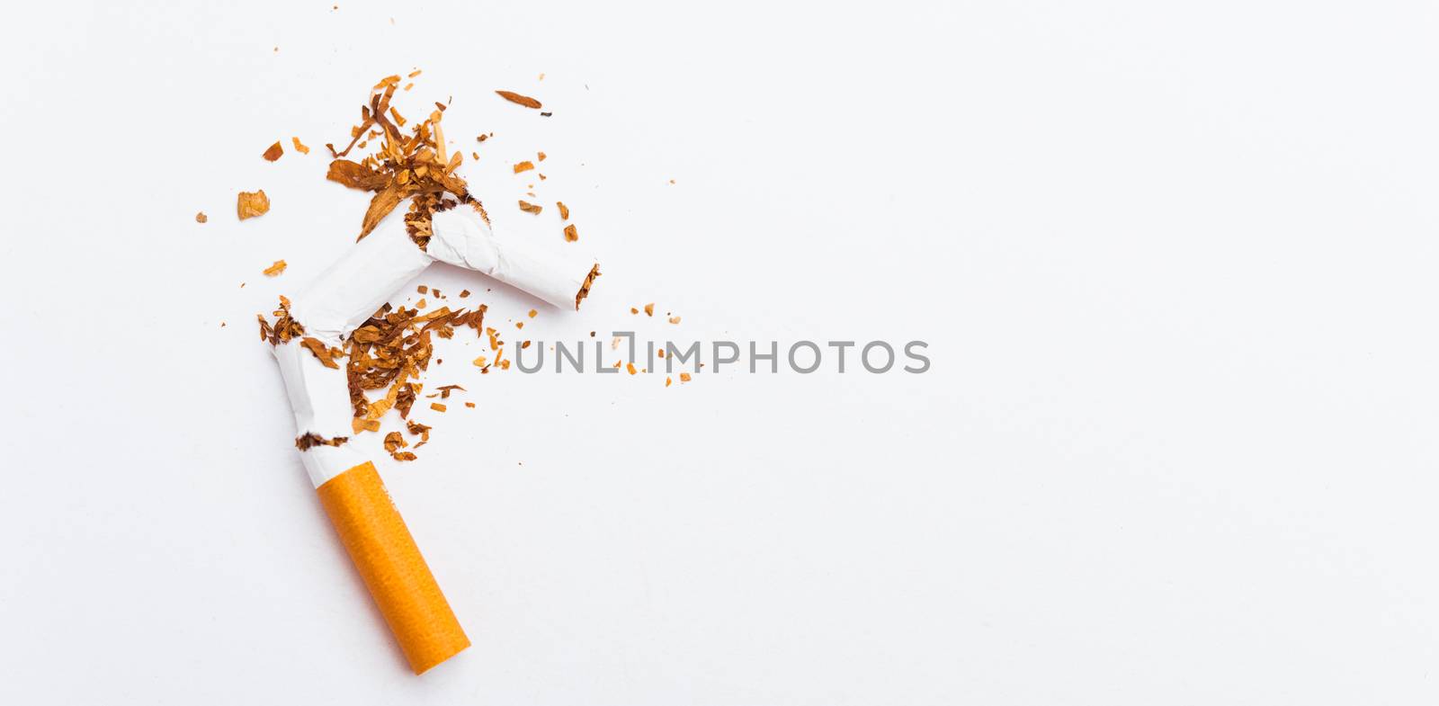 31 May of World No Tobacco Day, no smoking, close up of broken pile cigarette or tobacco STOP symbolic on white background with banner copy space, and Warning lung health concept