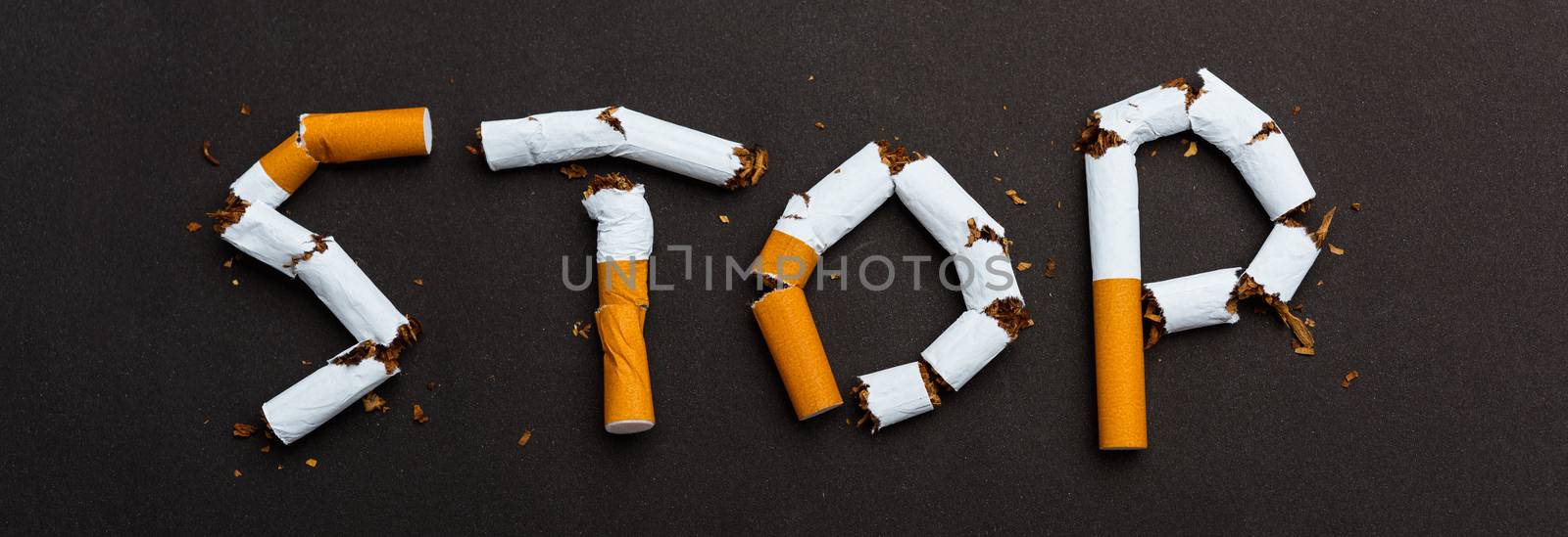 word STOP spelled text of the pile cigarette or tobacco by Sorapop