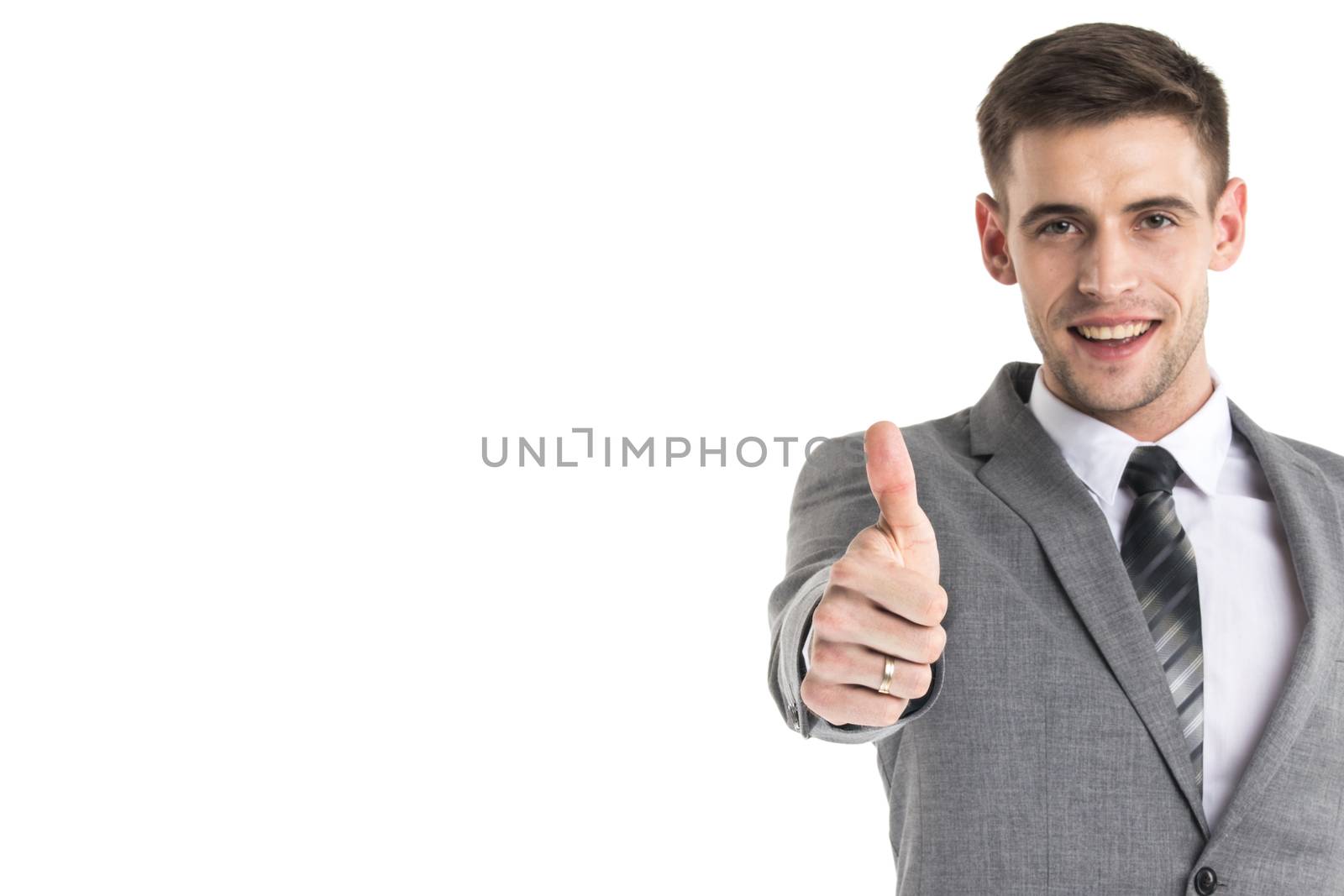 Smiling young businessman with thumb up isolated on white background