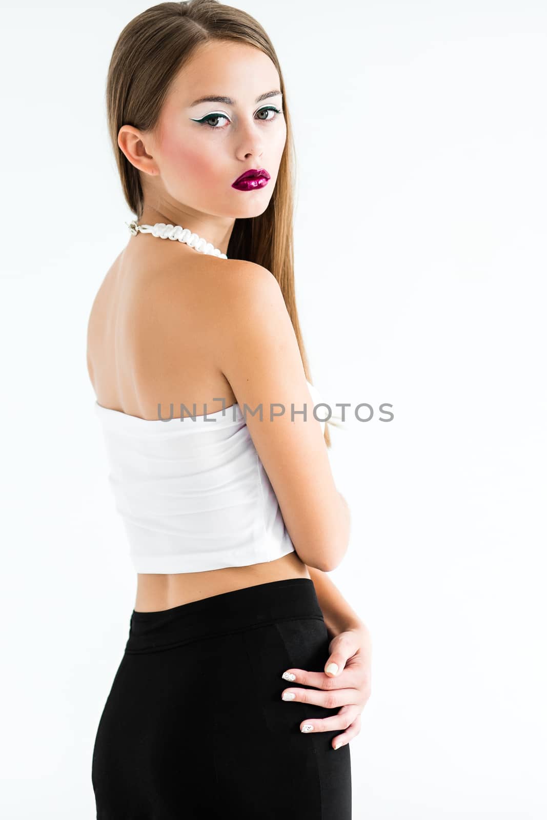 girl in a white blouse and black skirt on a white background