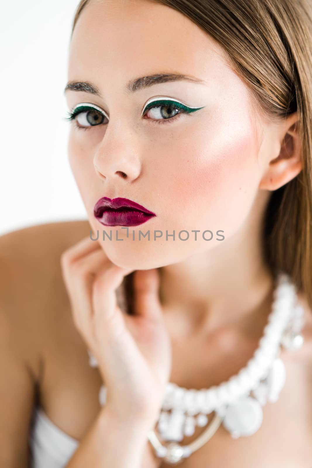 girl in a white blouse and black skirt on a white background