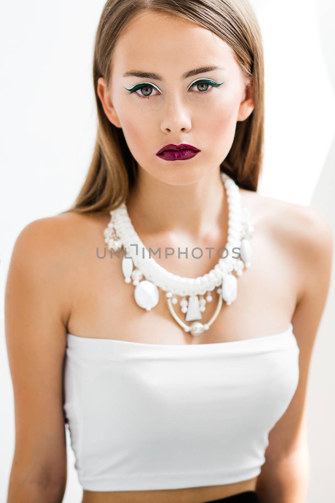 girl in a white blouse and black skirt on a white background