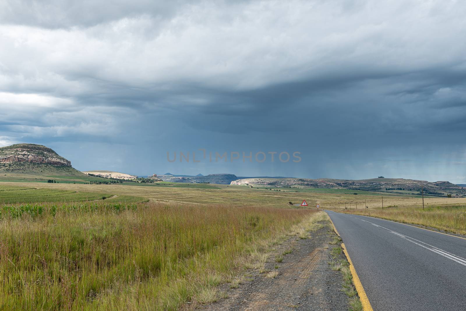 The landscape on road R26 to the south of Fouriesburg. A thunderstorm is visible