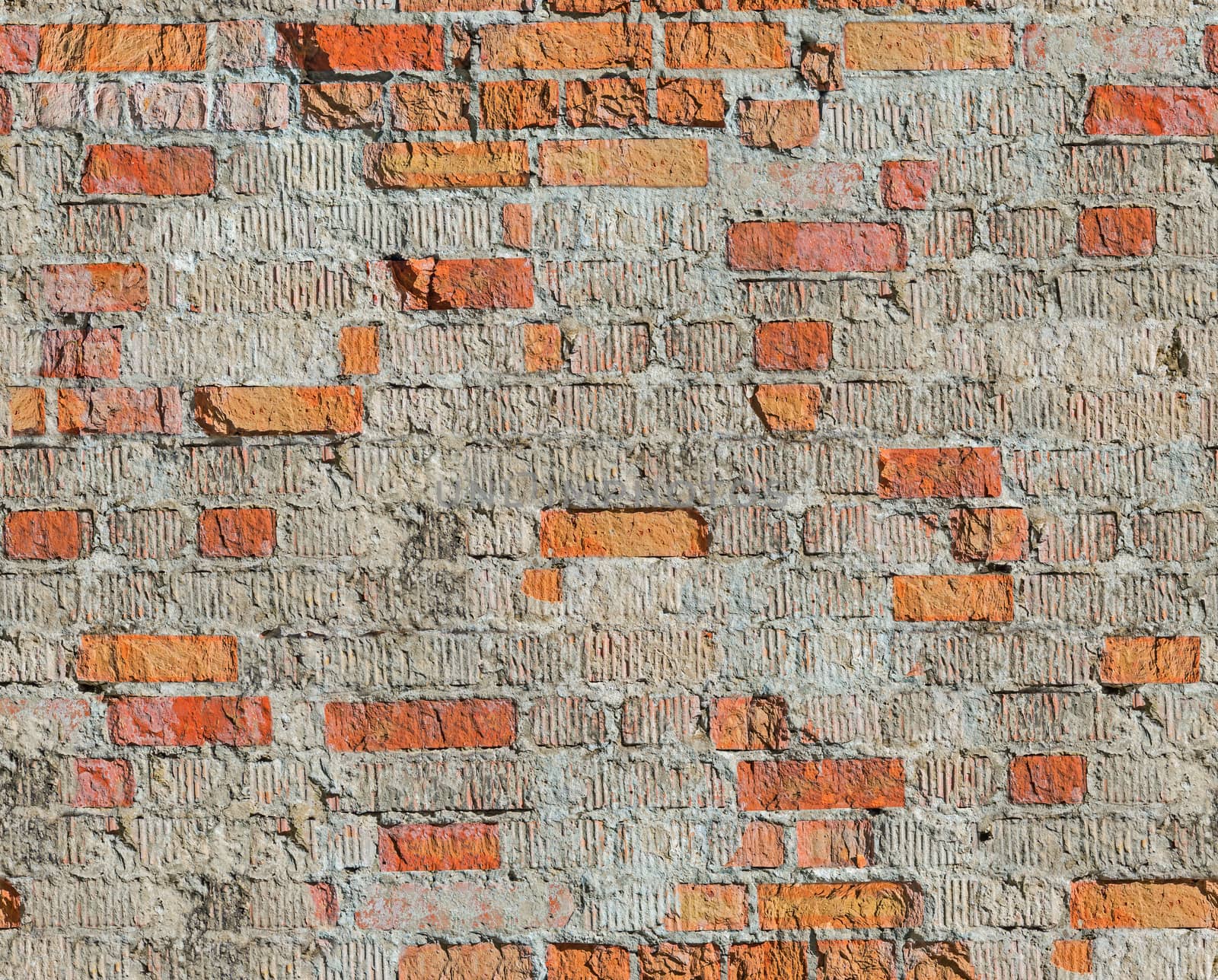 Brick wall of the old house of the 19th century restored after the bombing of the Second World War. Seamless texture