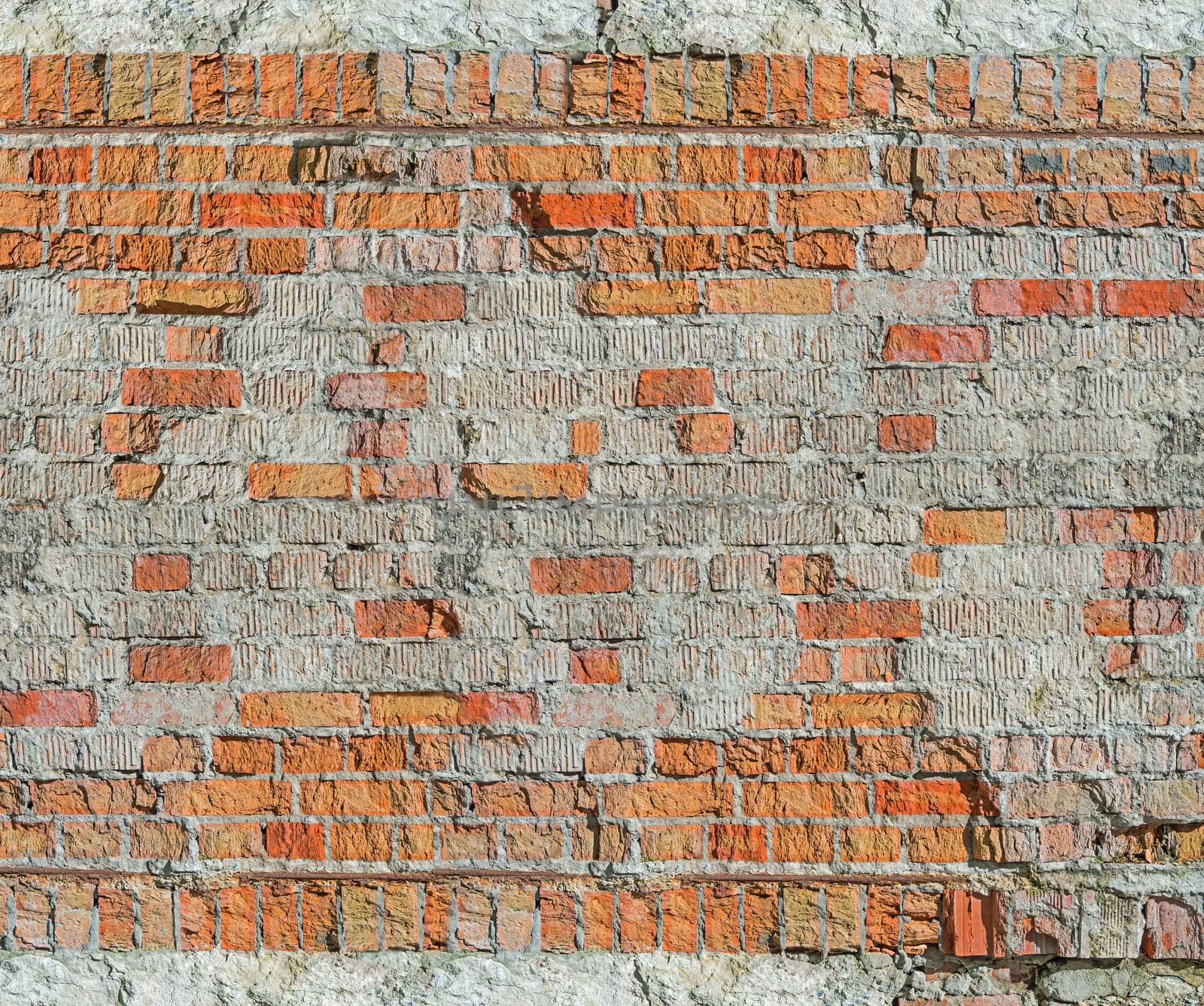 Brick wall of the old house of the 19th century restored after the bombing of the Second World War