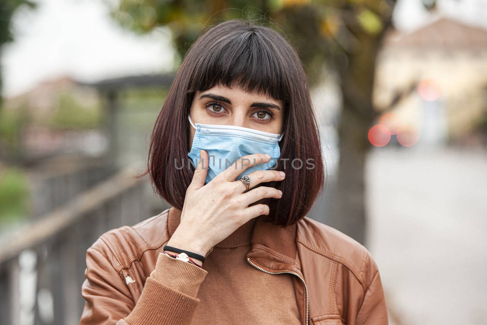 Portrait of a Girl with medical mask outdoor during covid quarantine in Italy