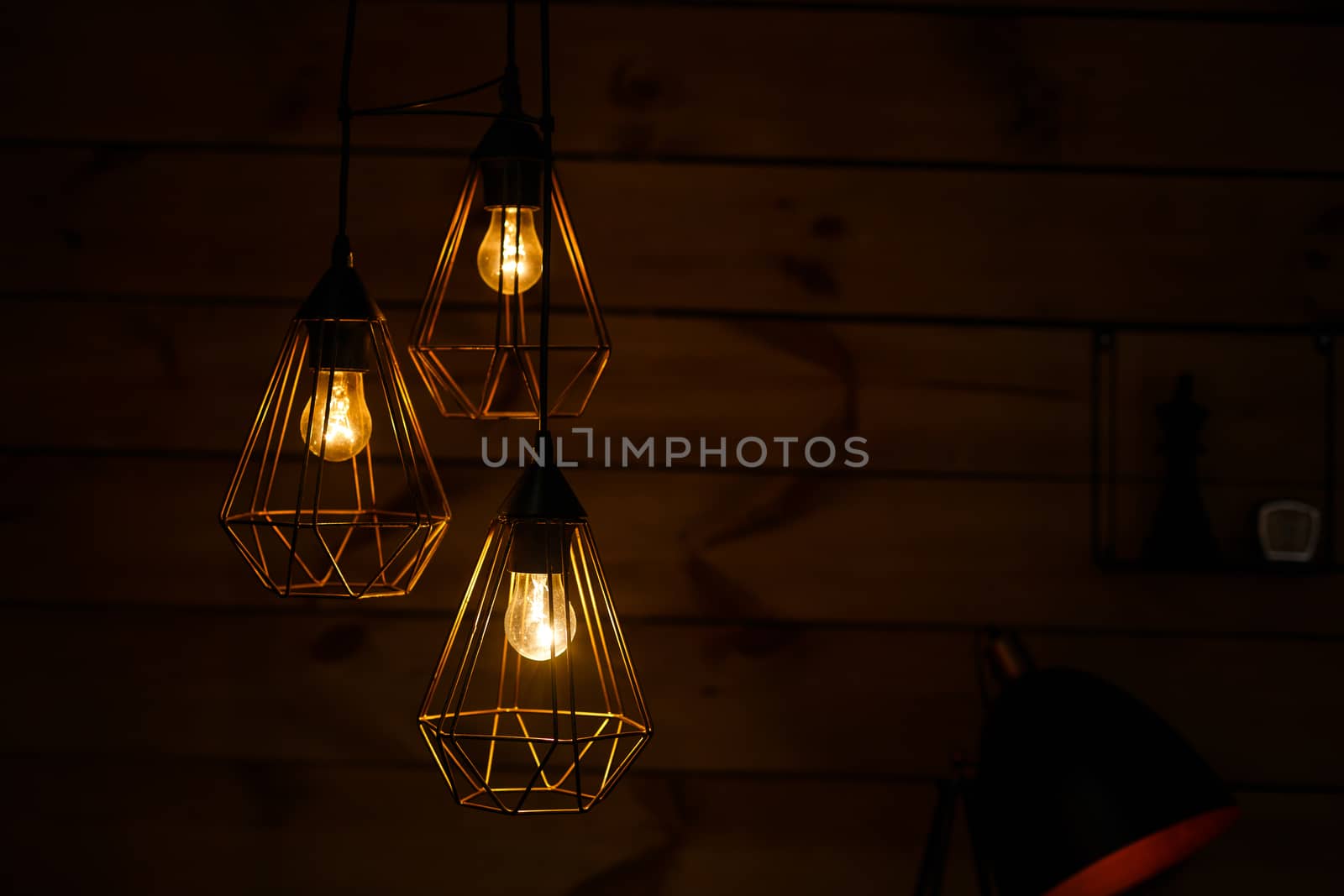 A close up of a clock tower lit up at night. High quality photo