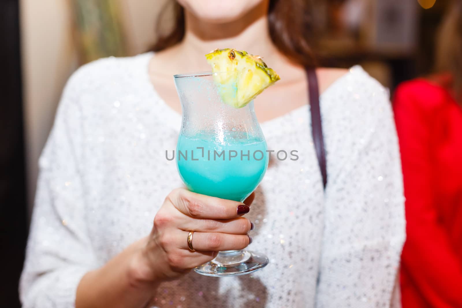 A person holding a wine glass. High quality photo