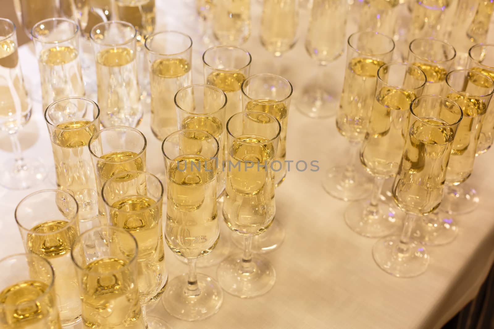 A table filled with wine glasses. High quality photo