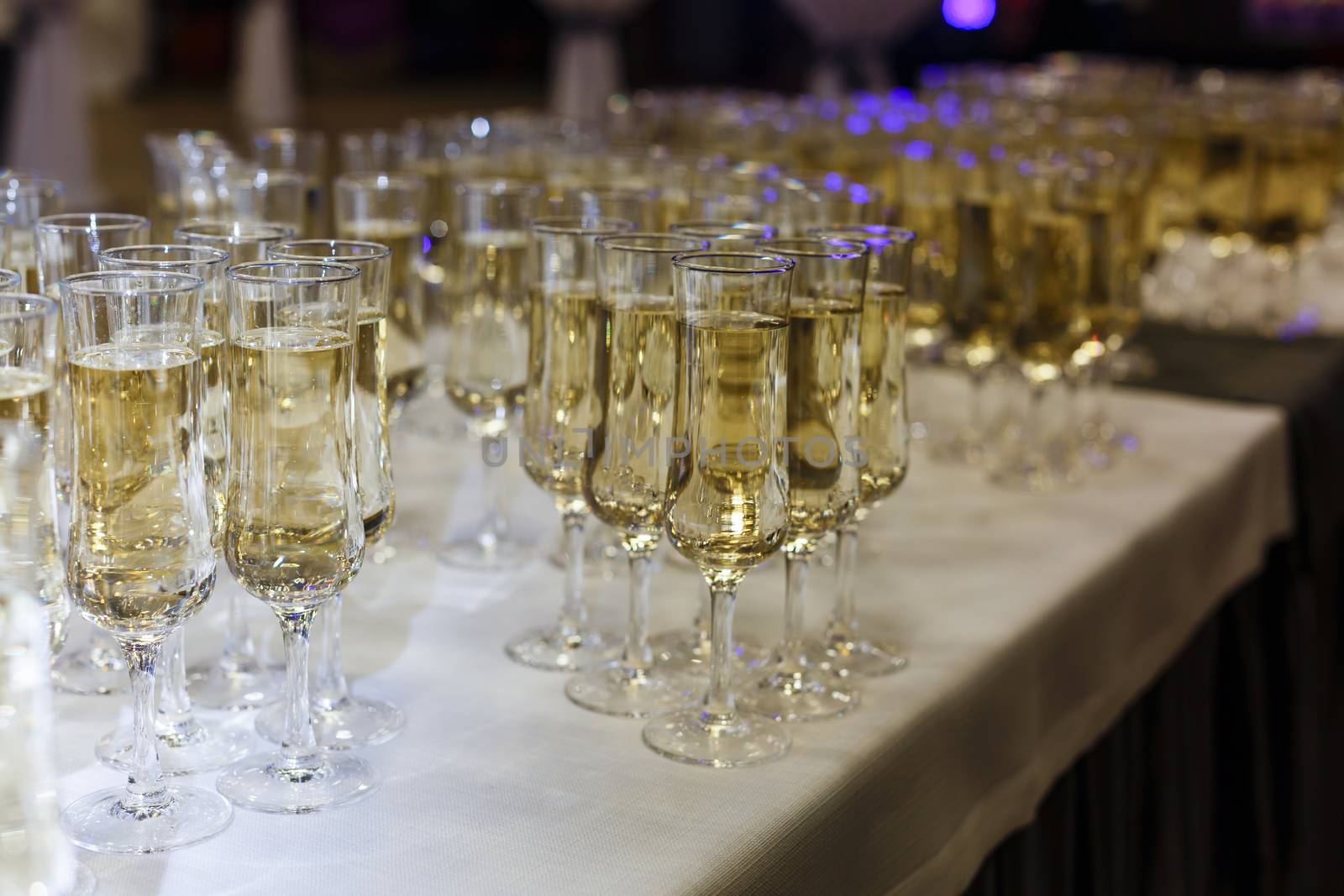 A row of wine glasses sitting on a table. High quality photo