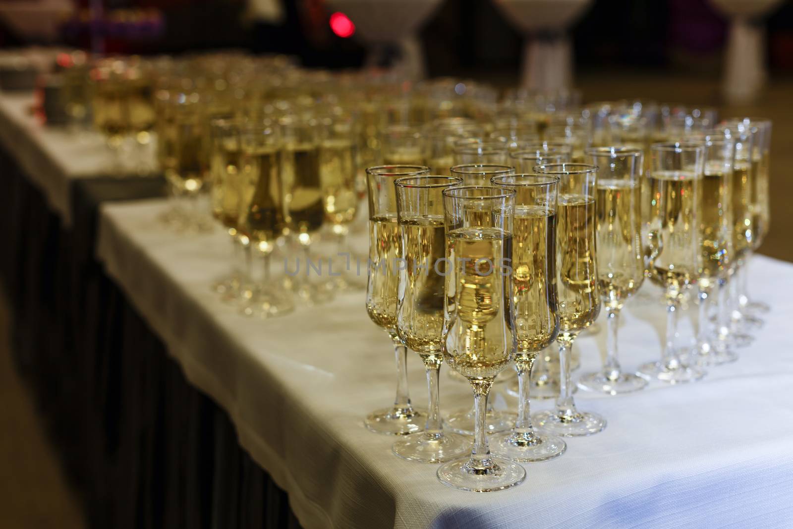 A row of wine glasses sitting on a table. High quality photo