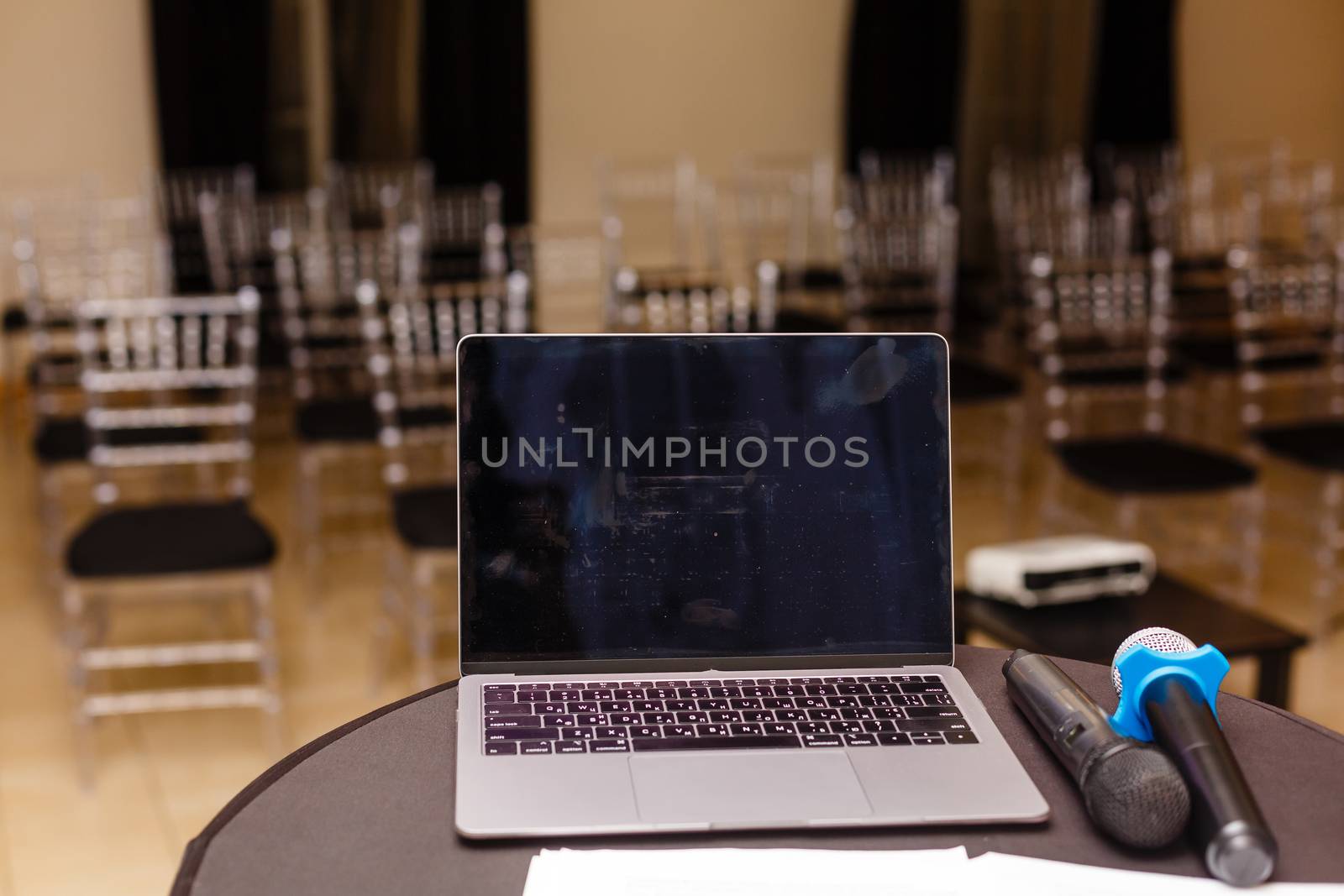 A close up of a laptop computer sitting on top of a table. High quality photo