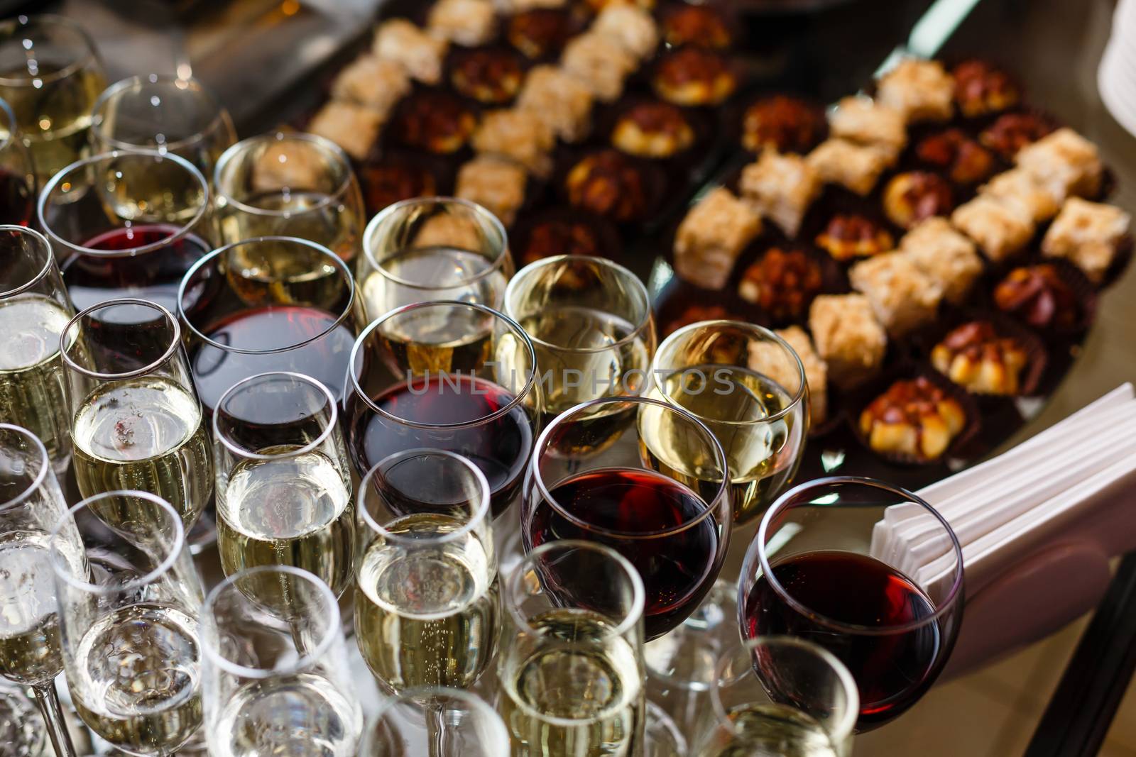 A dining table filled with wine glasses. High quality photo