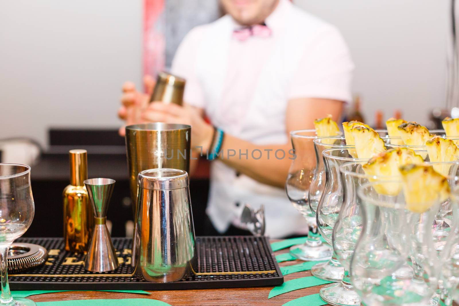 A person sitting at a table with wine glasses. High quality photo