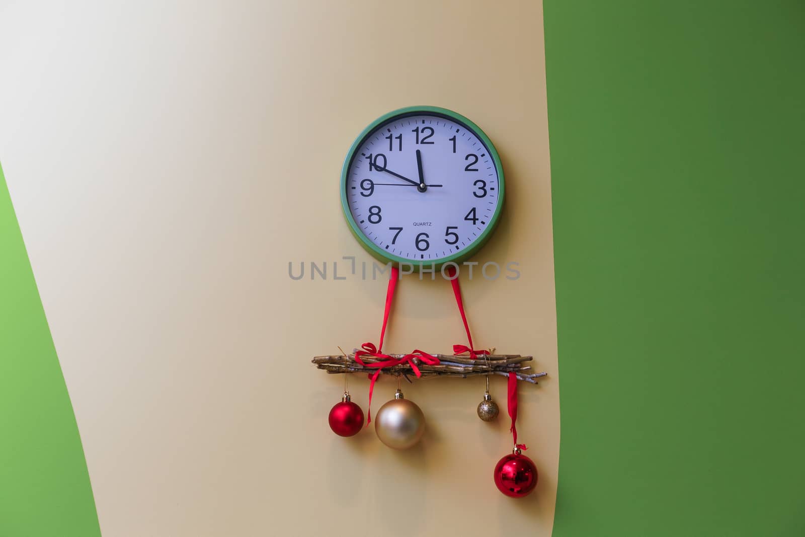 A clock hanging on the wall. High quality photo