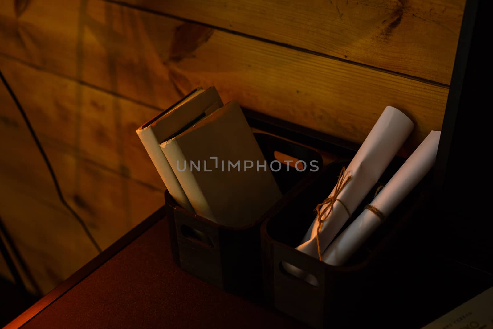 A laptop computer sitting on top of a wooden table. High quality photo