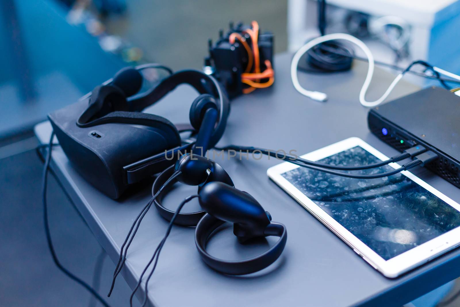 A black computer mouse on a table. High quality photo