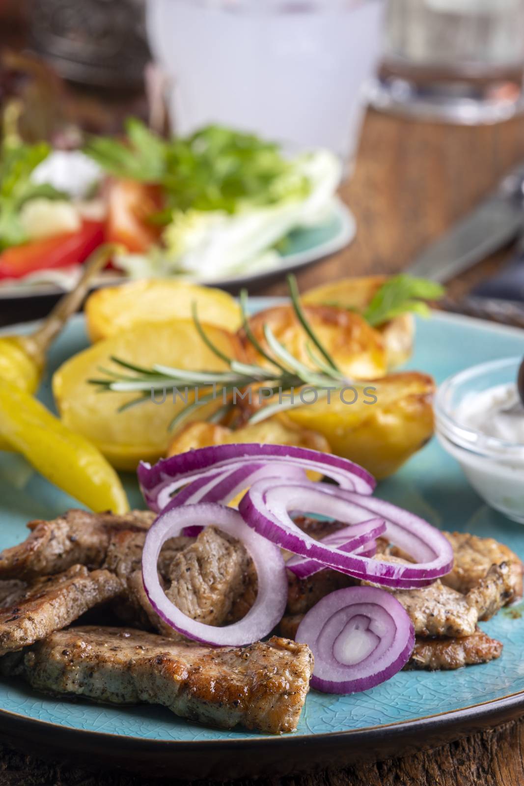 greek gyros with salad and ouzo