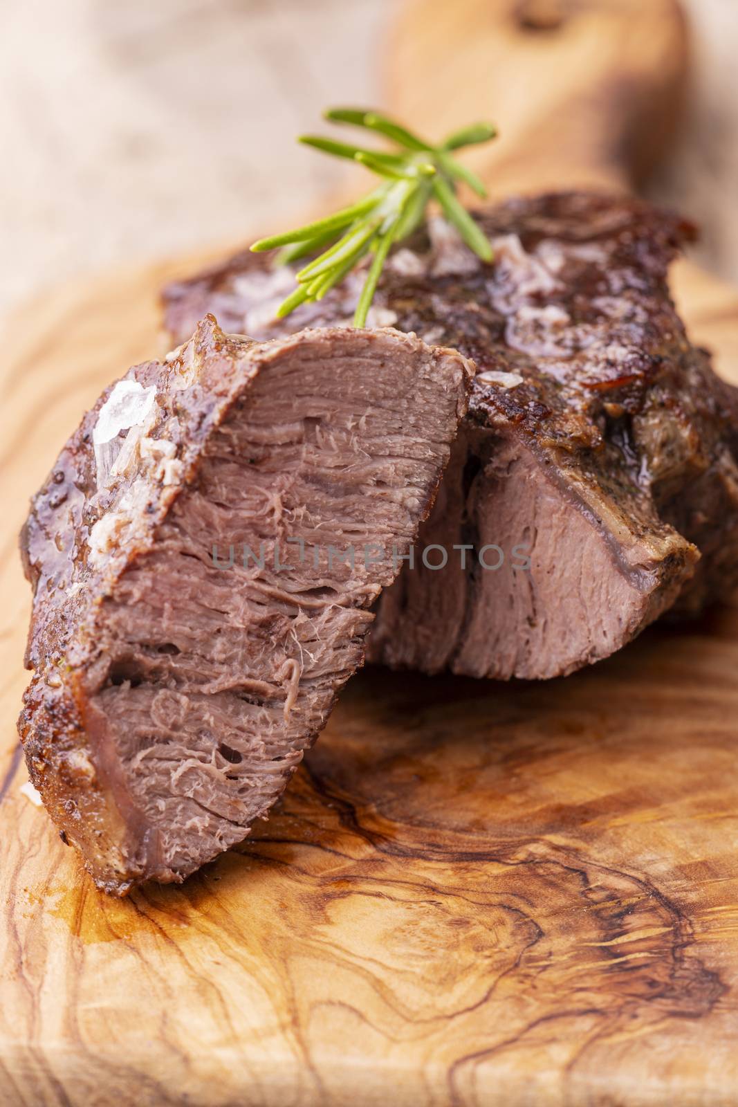 grilled juicy steak on olive wood