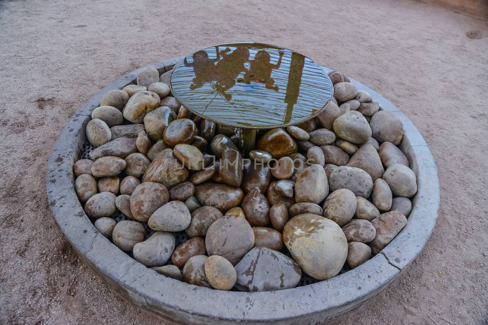 USA, PHENIX, ARIZONA- NOVEMBER 17, 2019: original small round fountain with fresh water at the entrance to the Phoenix Desert Botanical Garden, Arizona