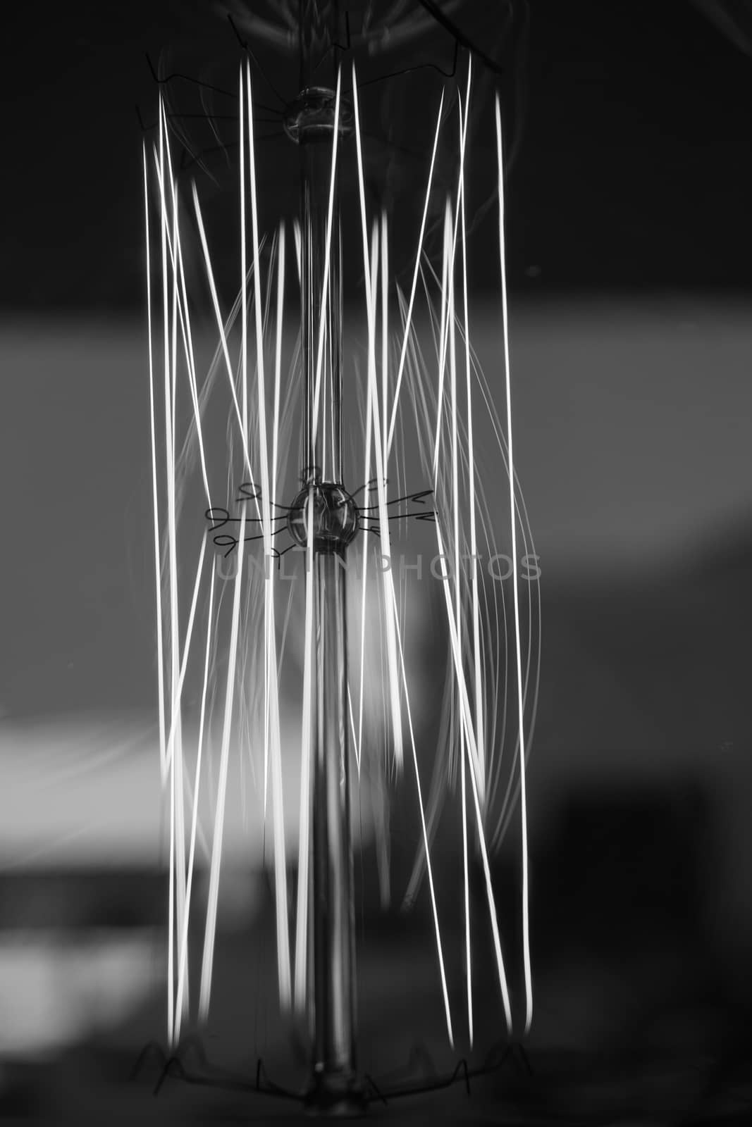 Amazing spiral electric current inside a retro crystal clear light bulb.