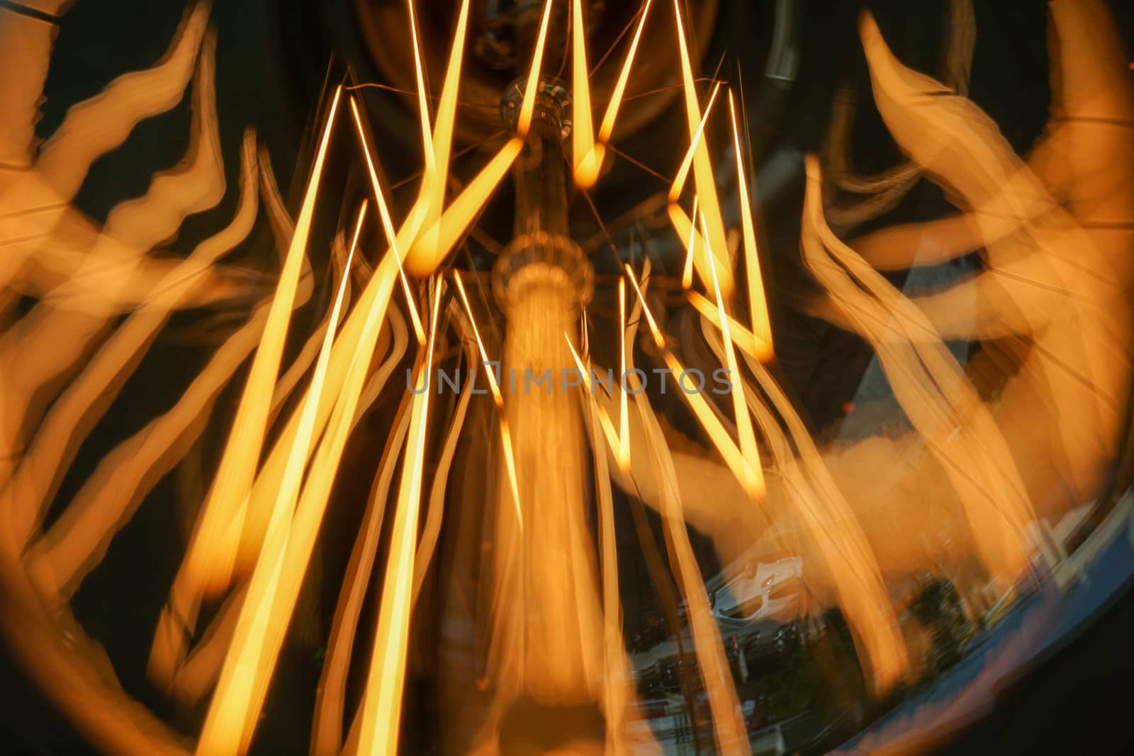 Amazing spiral electric current inside a retro crystal clear light bulb.