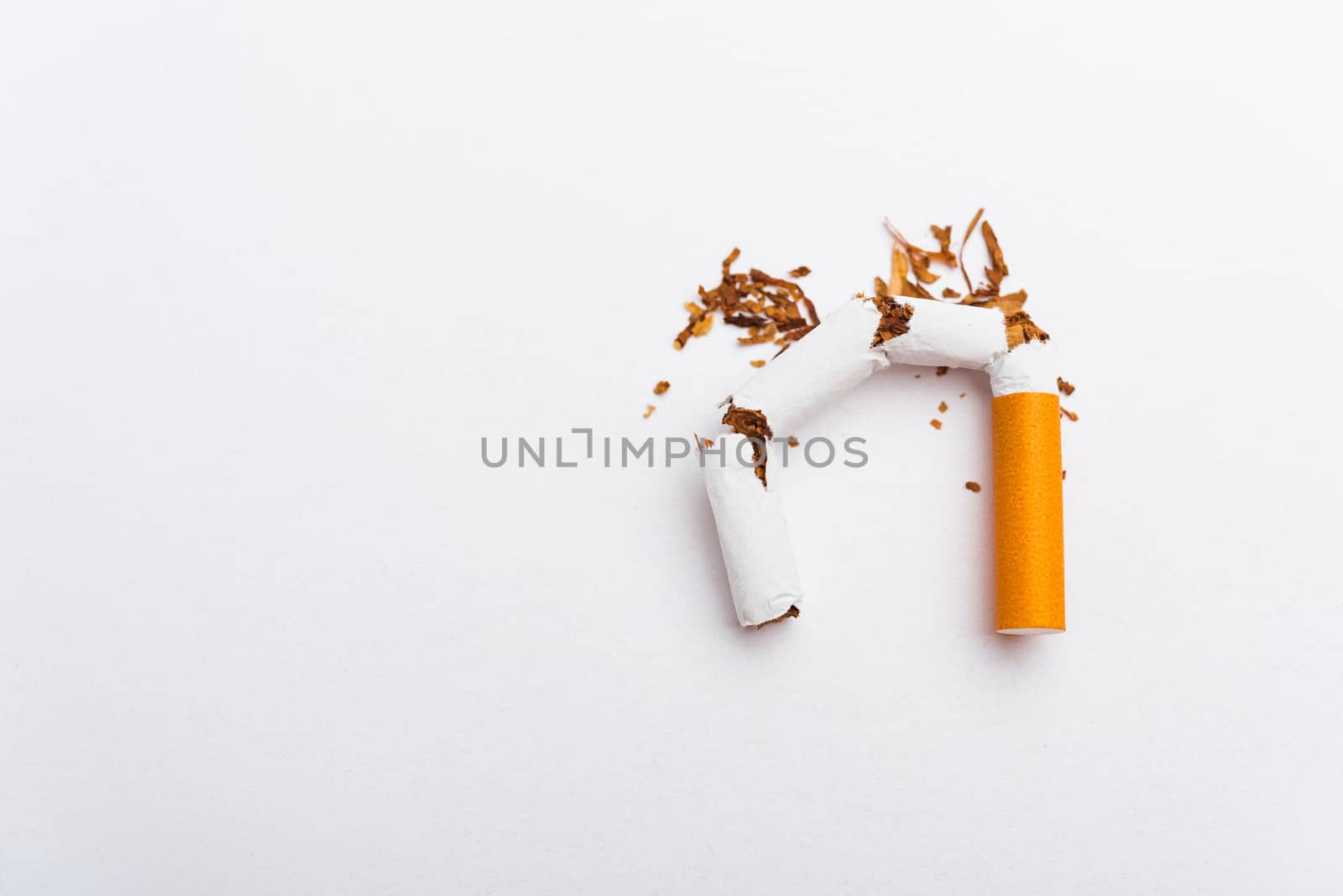 31 May of World No Tobacco Day, no smoking, close up of broken pile cigarette or tobacco STOP symbolic on white background with copy space, and Warning lung health concept