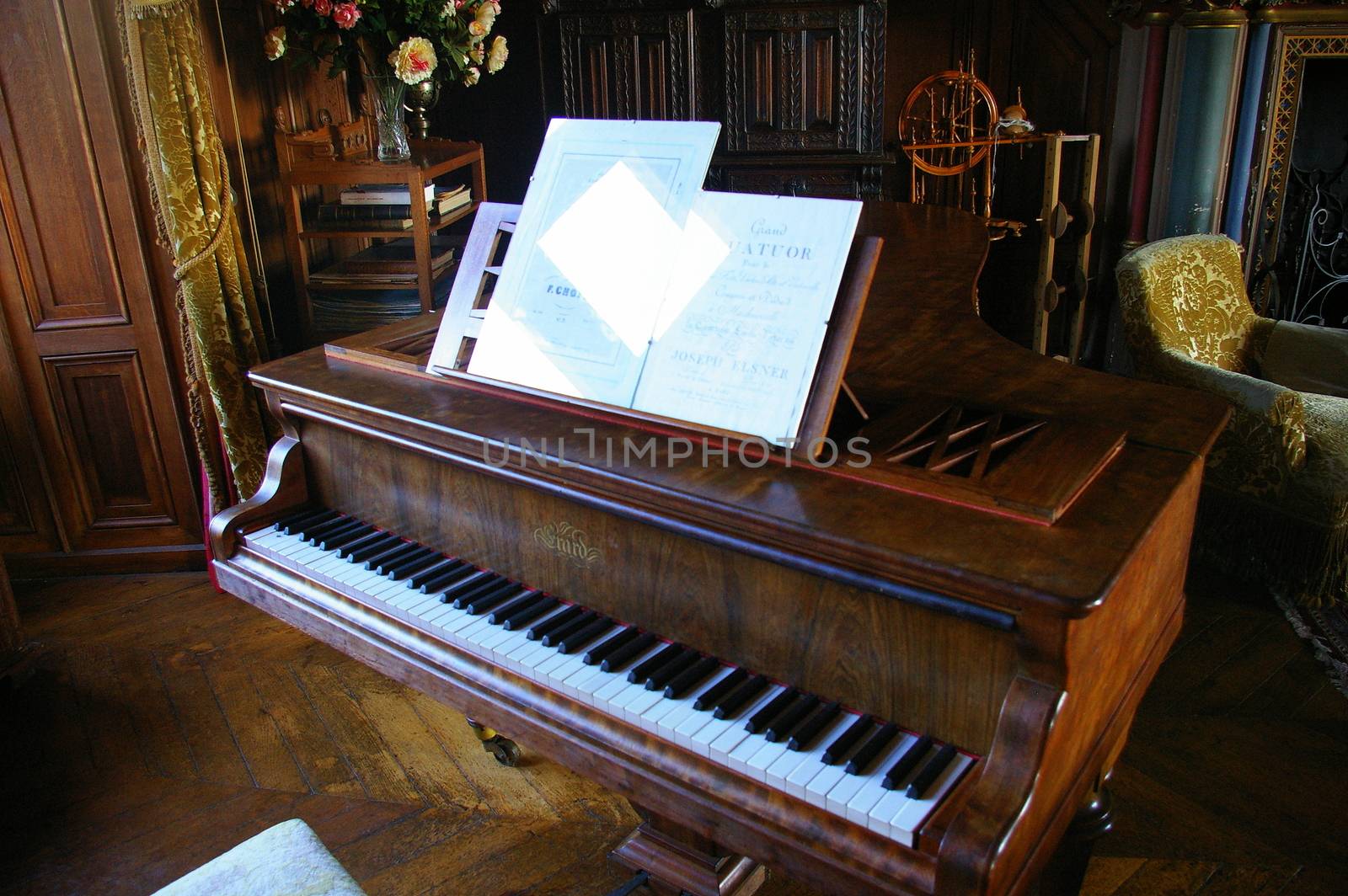 Antique piano in a room with period furniture by flaneur9