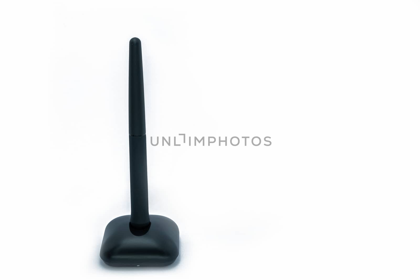 Wireless pen mouse on stand for using with computer, side and front on isolated white background. by peerapixs