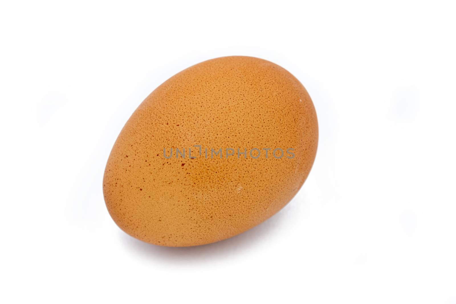 Close up chicken egg isolated on white background by peerapixs