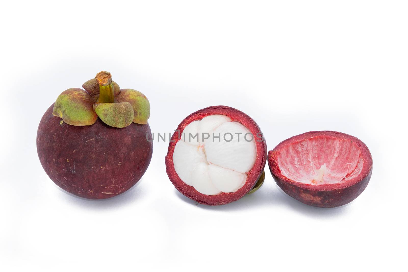 The Mangosteen and cross section showing the thick purple skin and white flesh of the queen of fruits, Delicious mangosteen fruit arranged on a bowl, Mangosteen flesh, closeup. Mangosteen.