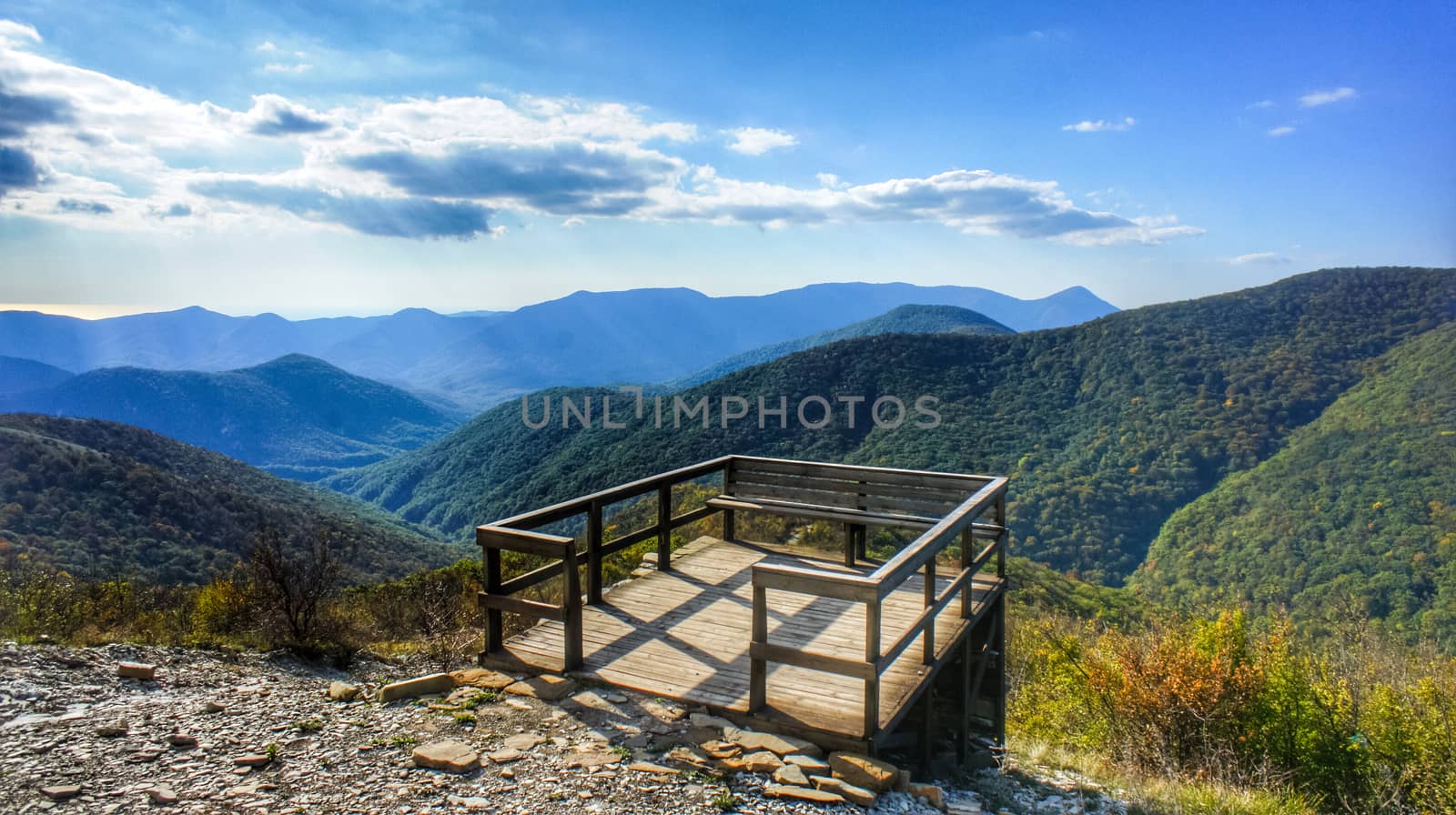 A observation deck made of wood in the mountains. The beginning of the Caucasian mountains.