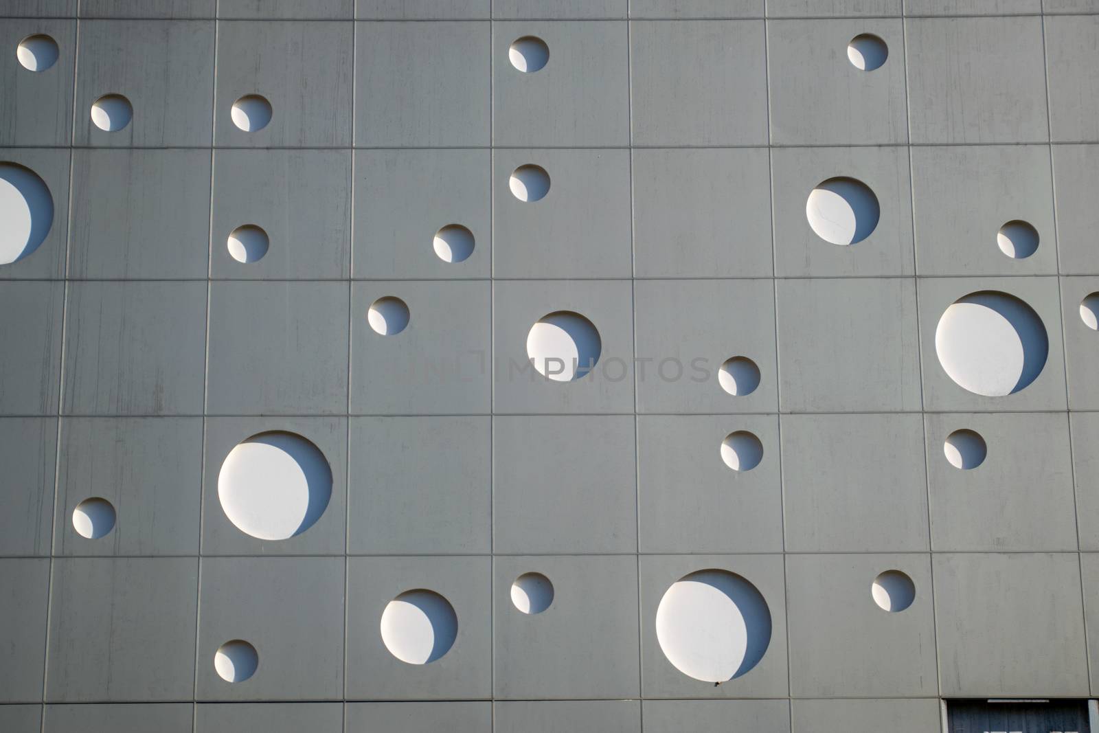 Background texture. wall with round holes in the form of gas bubbles. by fedoseevaolga