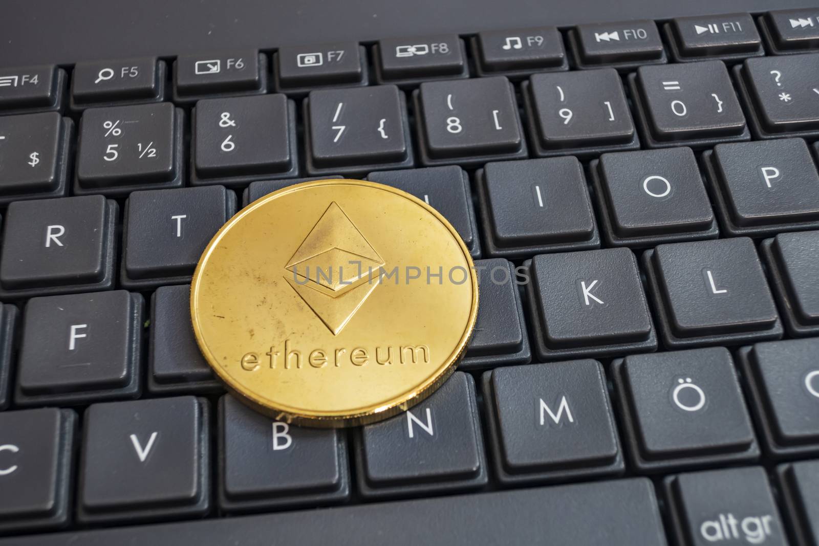 close up cryptocurrency coins on keyboard background