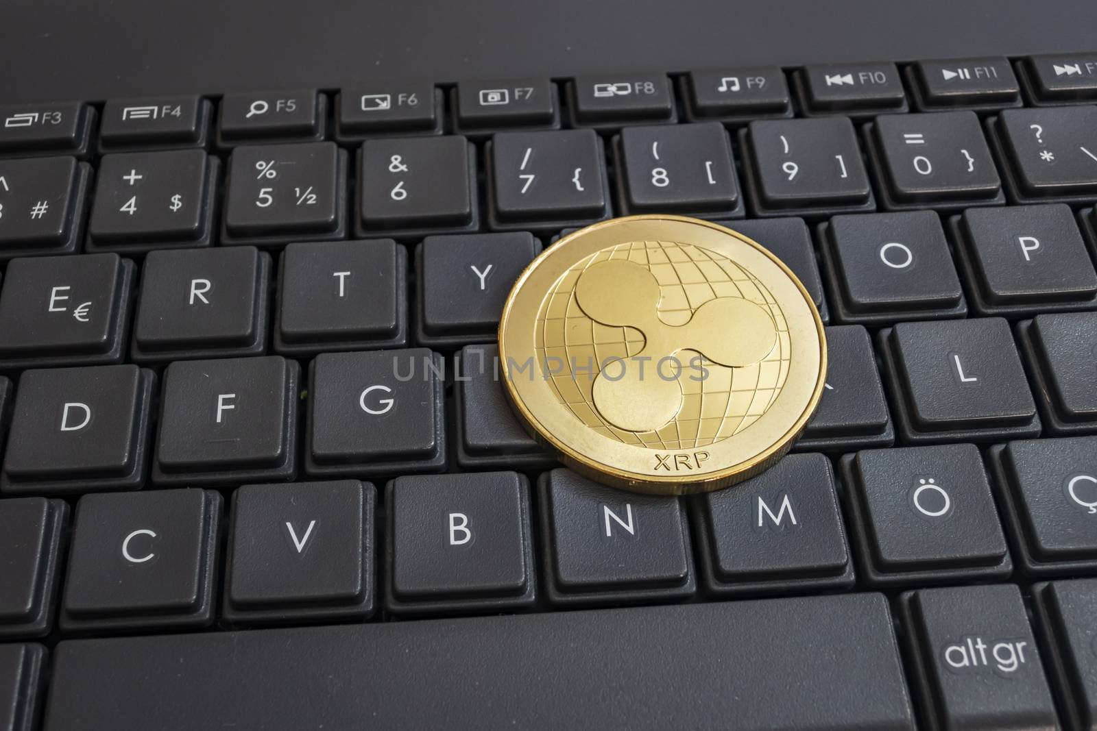 close up cryptocurrency coins on keyboard background