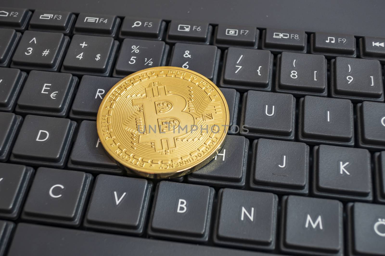 close up cryptocurrency coins on keyboard background