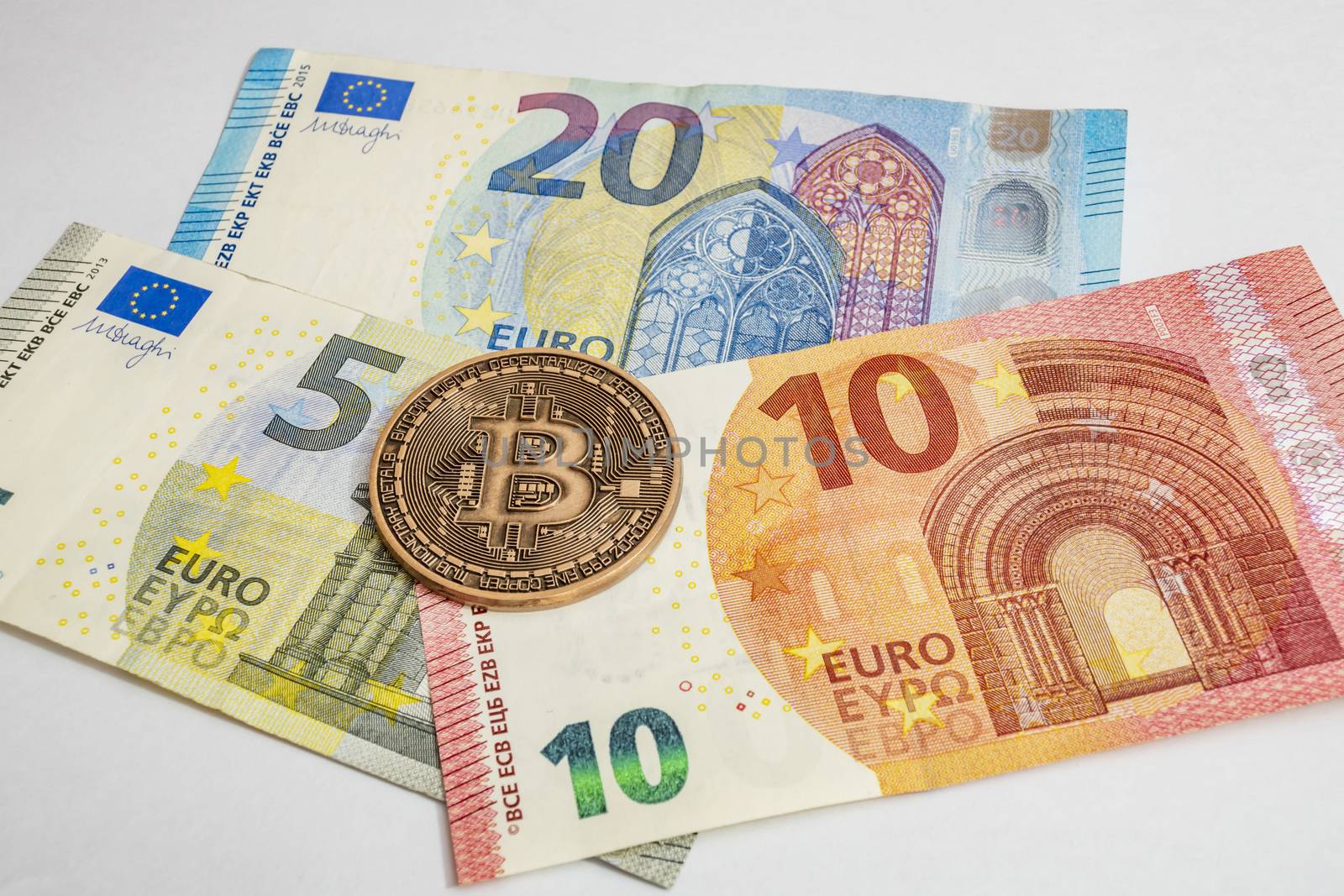 close up cryptocurrency coins on banknotes background