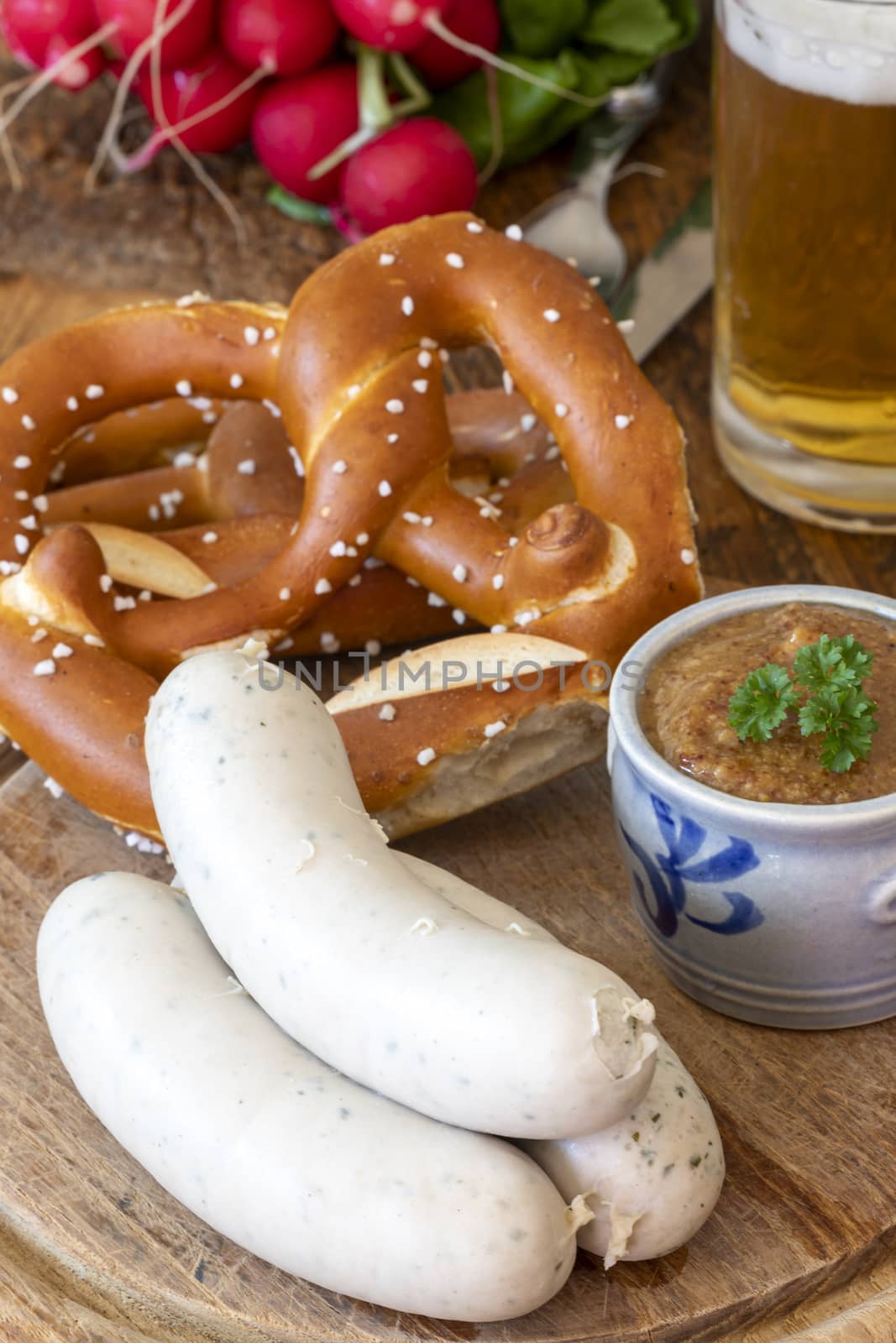 three bavarian white sausages with mustard