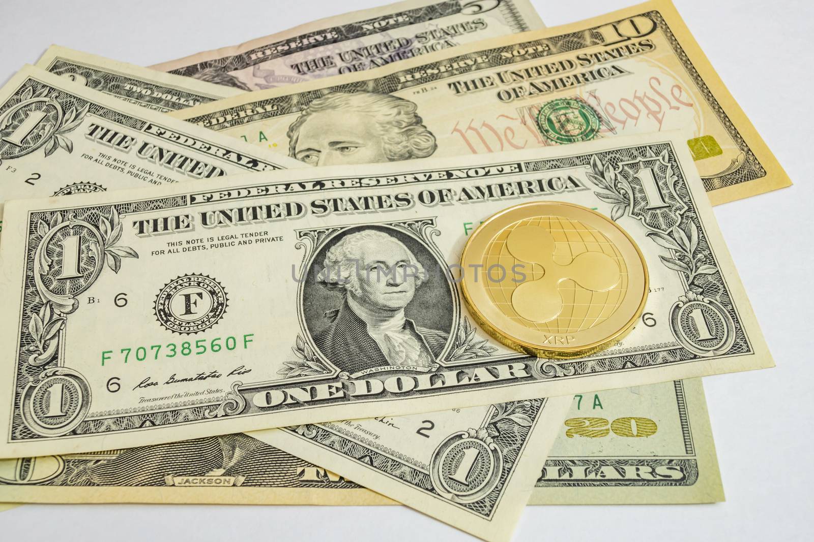 close up cryptocurrency coins on banknotes background