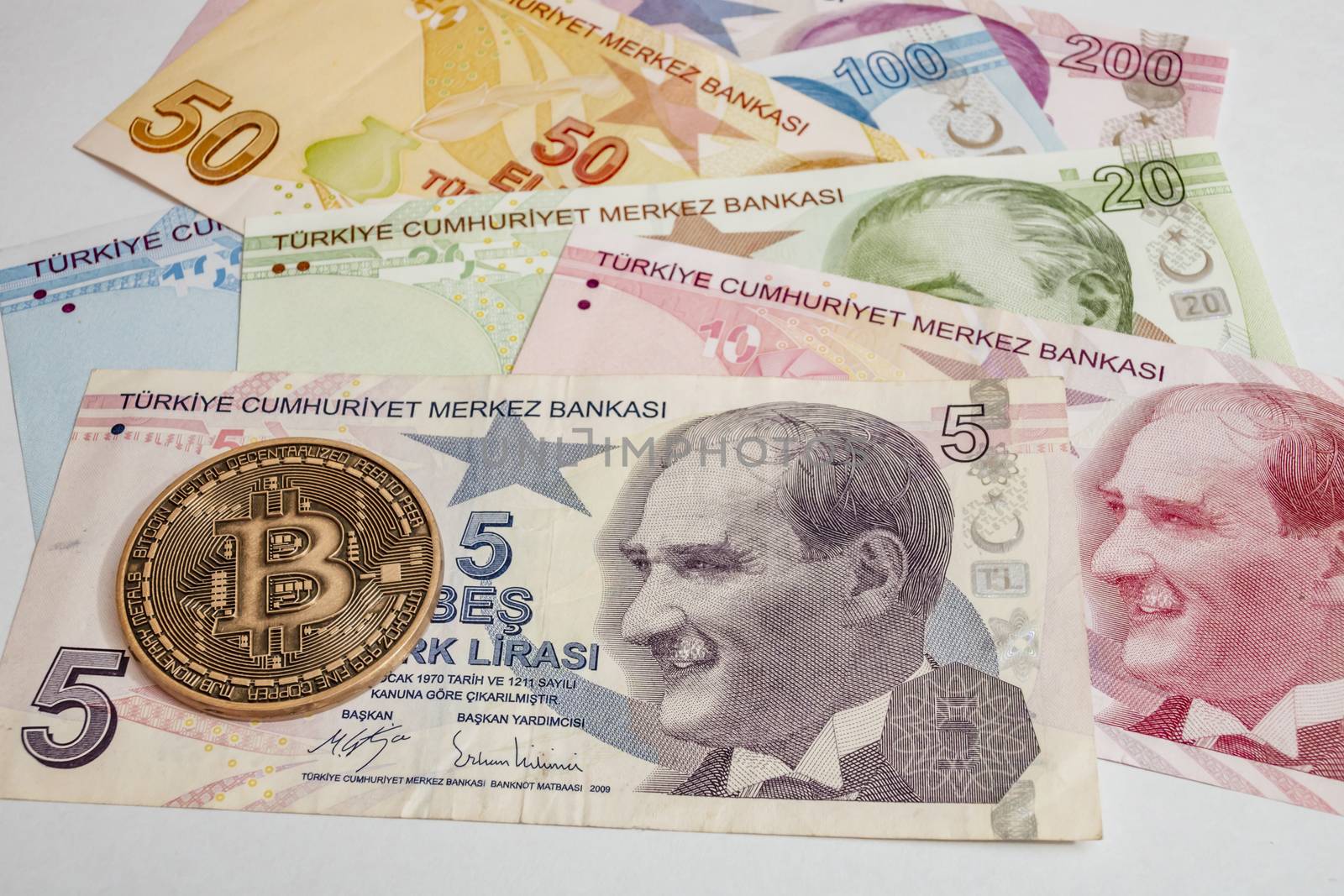 close up cryptocurrency coins on banknotes background