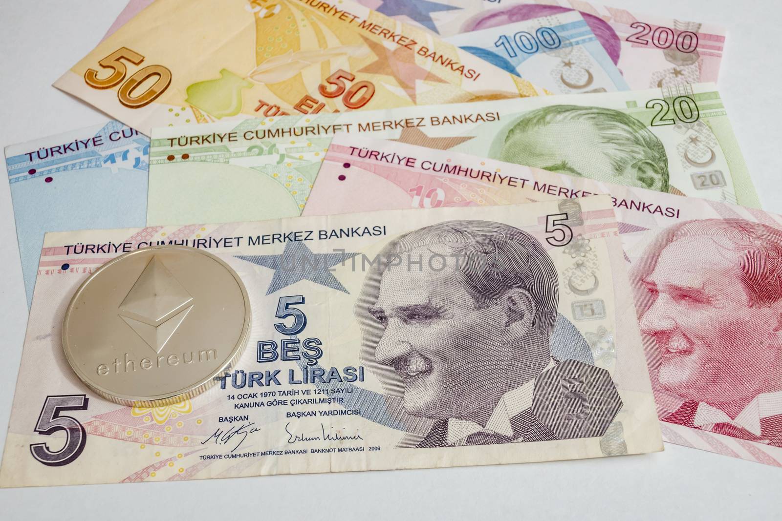 close up cryptocurrency coins on banknotes background