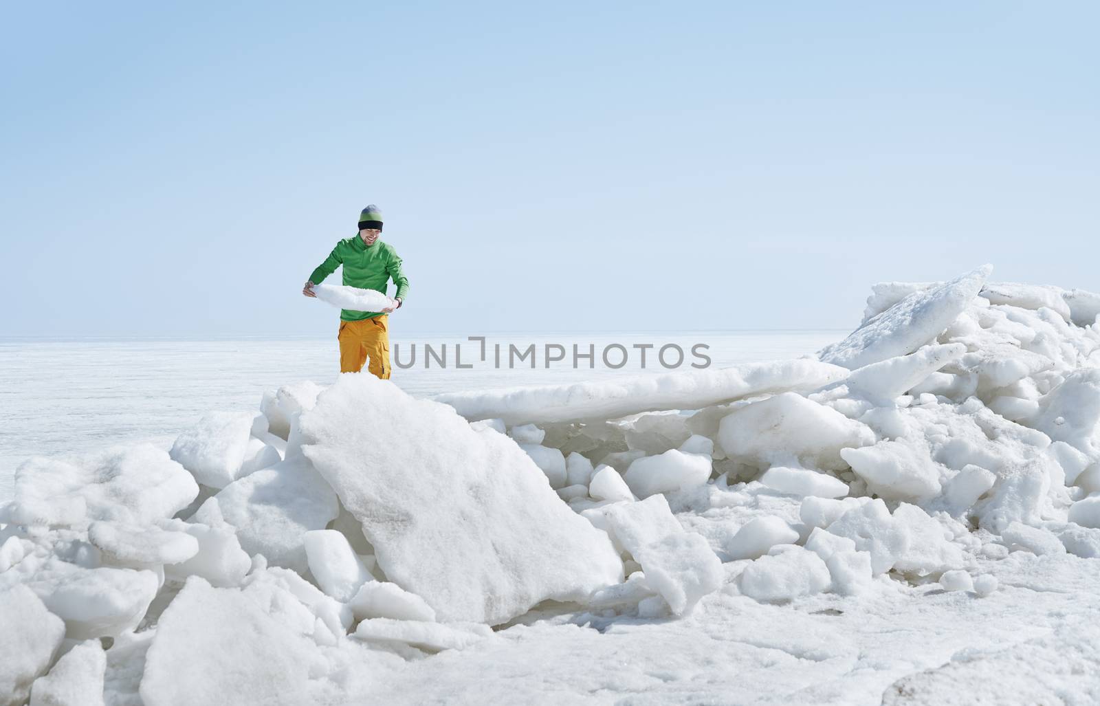 Young adult man outdoors exploring icy landscape